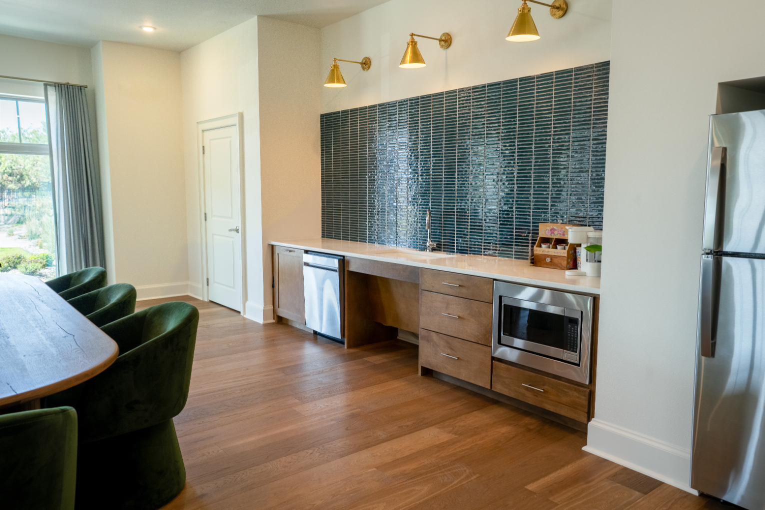Clubhouse dining area with kitchen featuring stainless steel appliances
