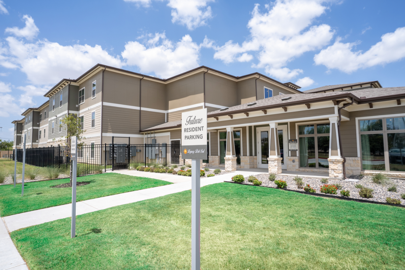 Exterior with parking sign outside of leasing office