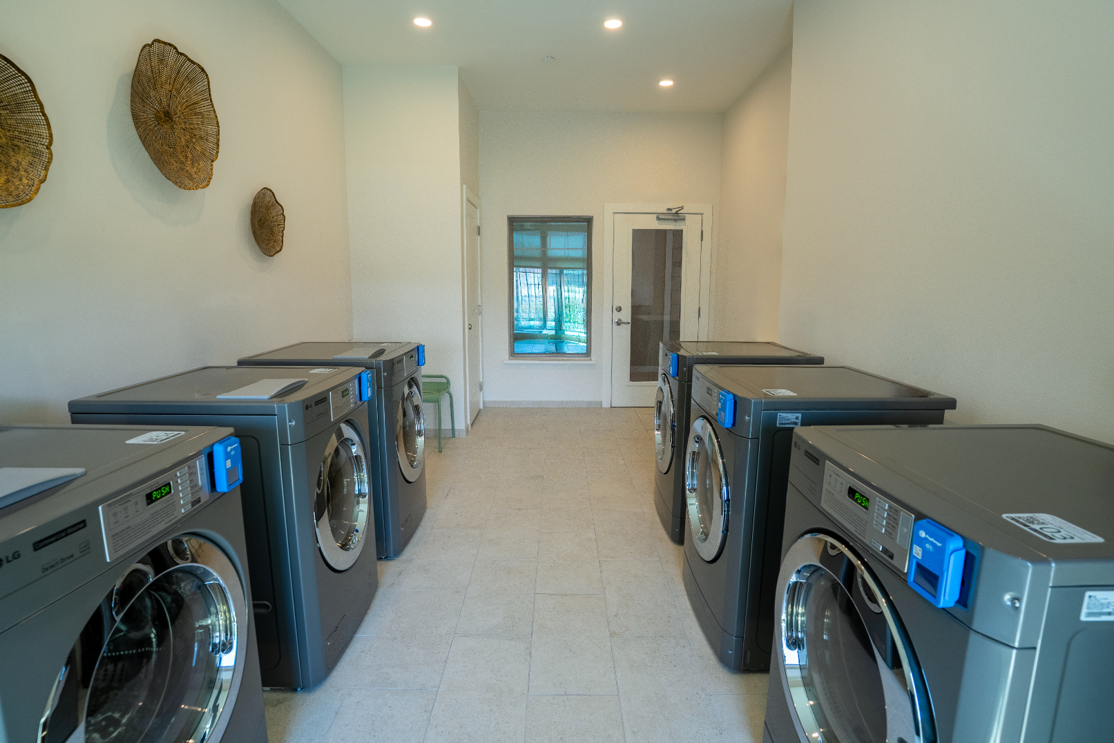 Fitness Laundry room with washer and dryers