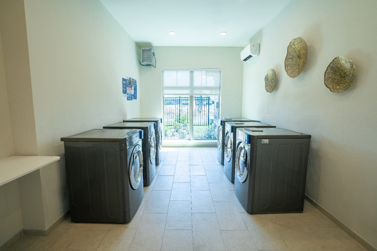 Fitness Laundry room with washer and dryers