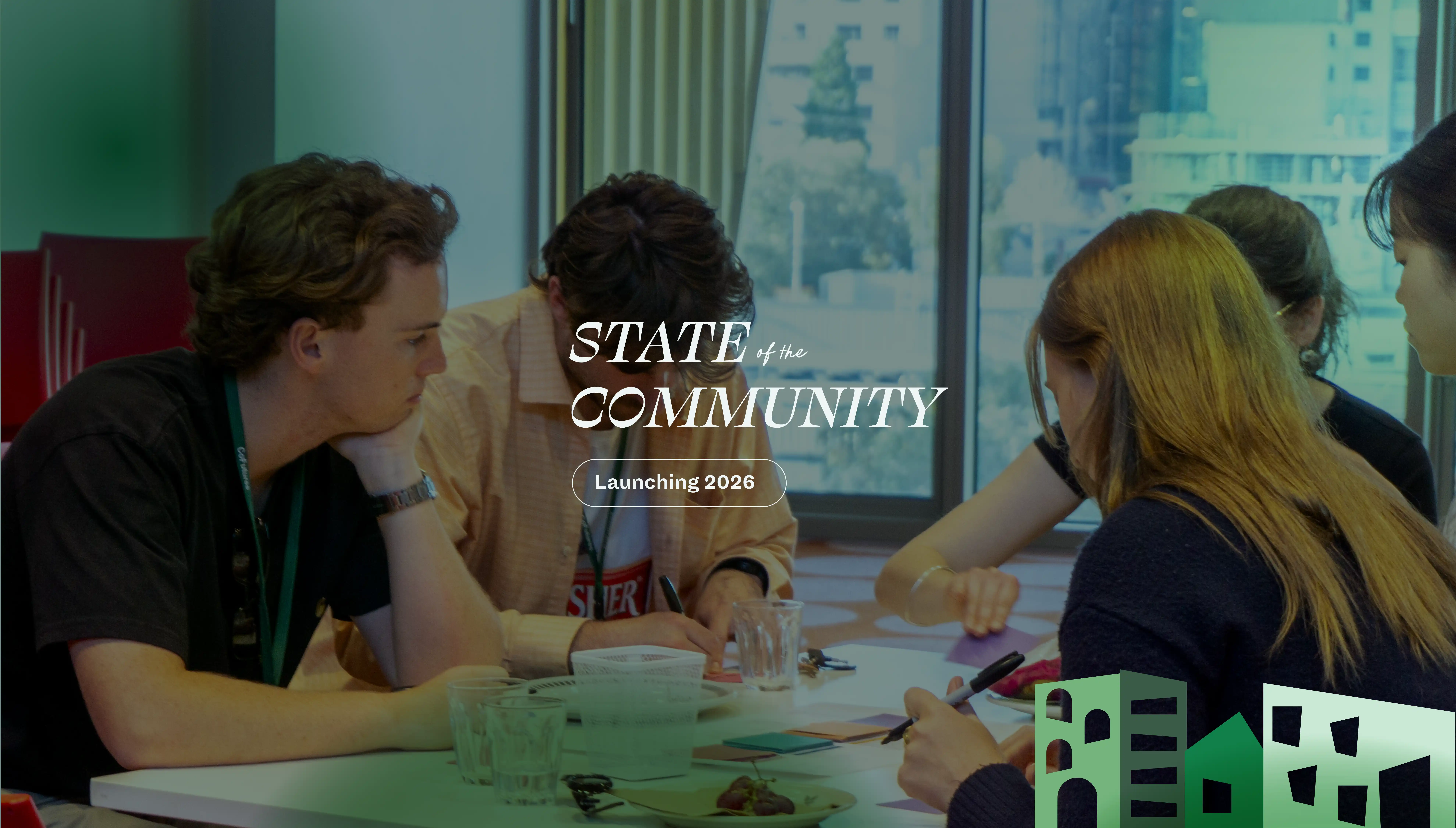 Group of young people collaborating at a table with papers and pens near a window, with overlay text reading 'STATE of the COMMUNITY Launching 2026'.