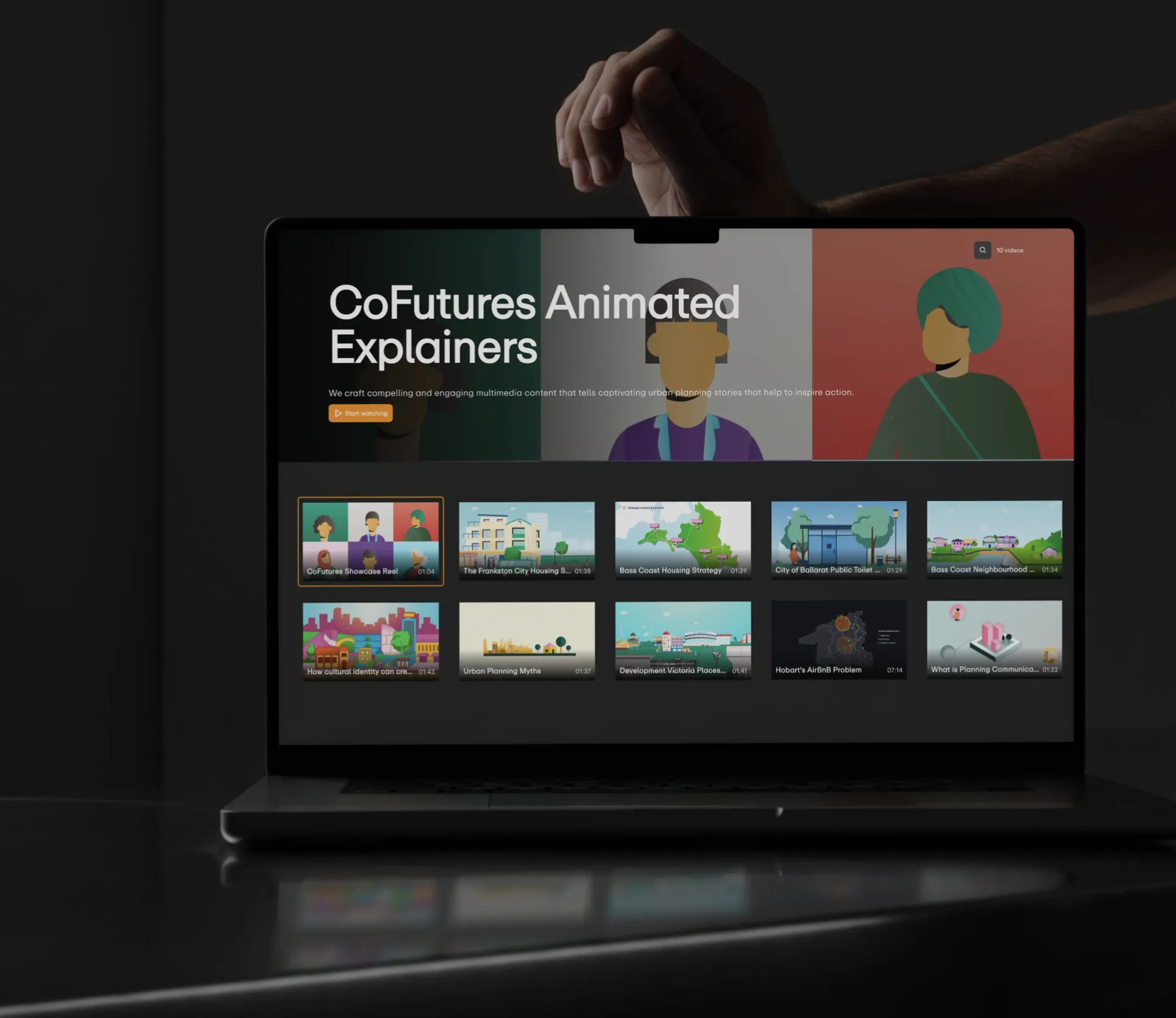 Laptop screen showing CoFutures Animated Explainers webpage with video thumbnails and a headline about crafting engaging urban planning stories.