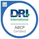 Logo de DRI International avec la mention ABCP certifié en bleu et vert.