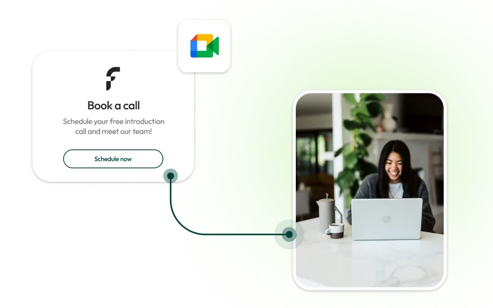 Smiling woman using laptop at a table with a travel mug and cup nearby, alongside text inviting to book a free introduction call with a schedule button.