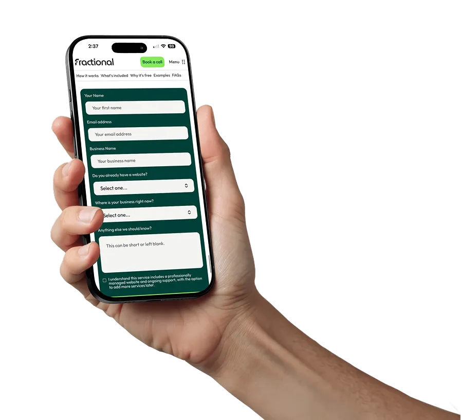 Hand holding a smartphone displaying a Fractional website contact form with fields for name, email, business name, website status, business location, and additional notes.