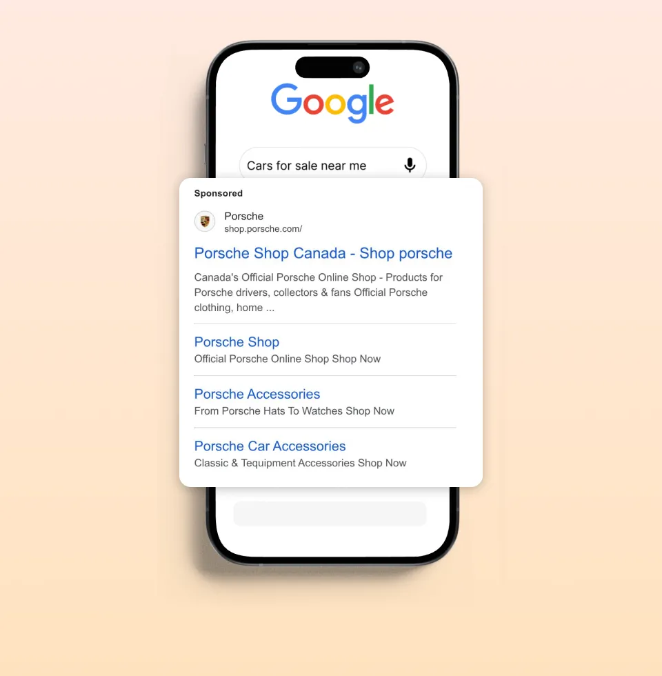 A phone with google search results popping out of the phone. The search result is an ad for Porsche Canada.