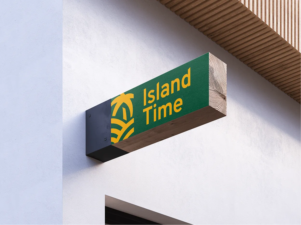 A wooden sign hanging above a storefront that says "island time"