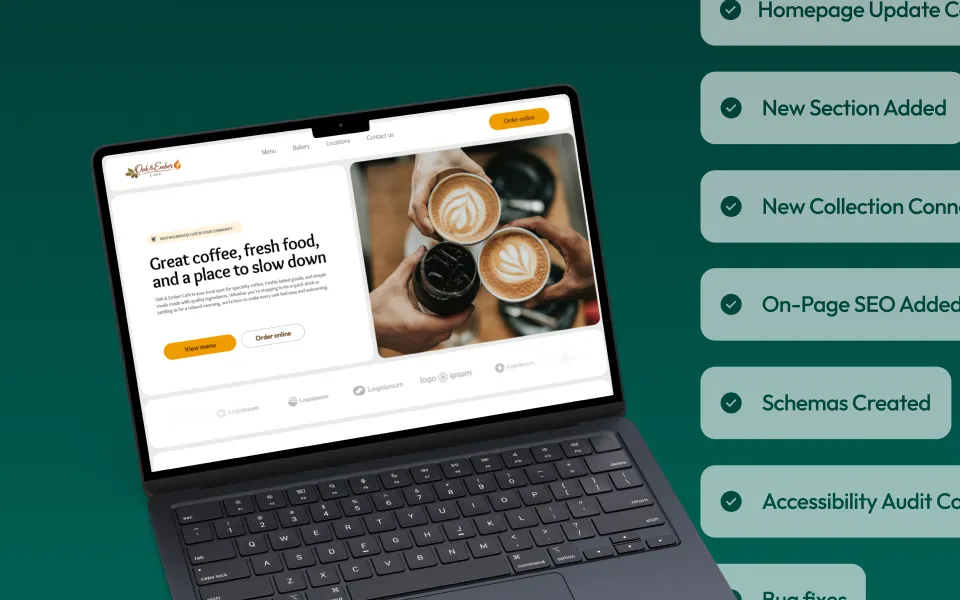 A laptop with a demo site on the screen. Cards showing items that have been completed are checked off in the background.