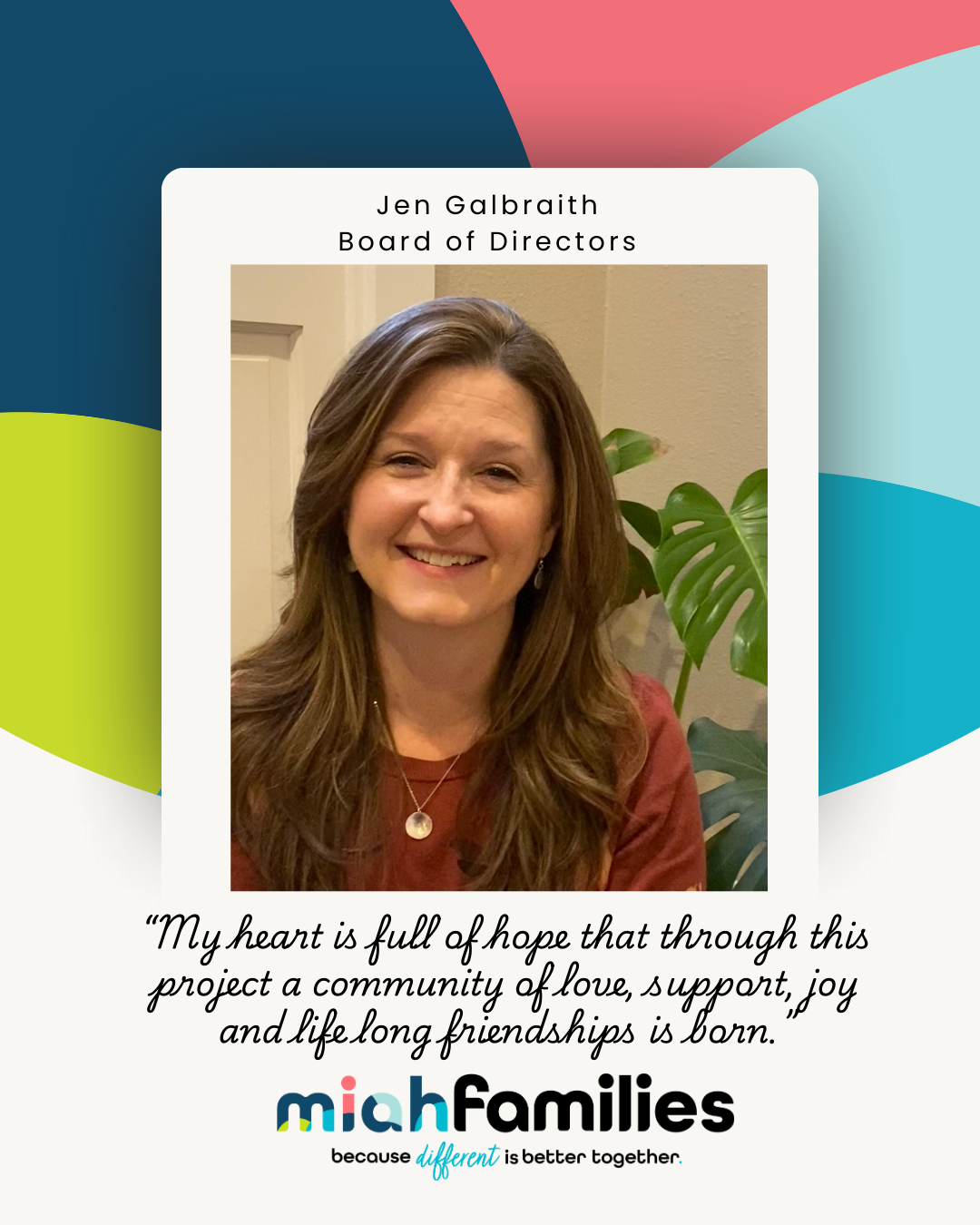 Smiling woman with curly hair in a bun wearing a white blouse, high-waisted black pants, and layered necklaces.