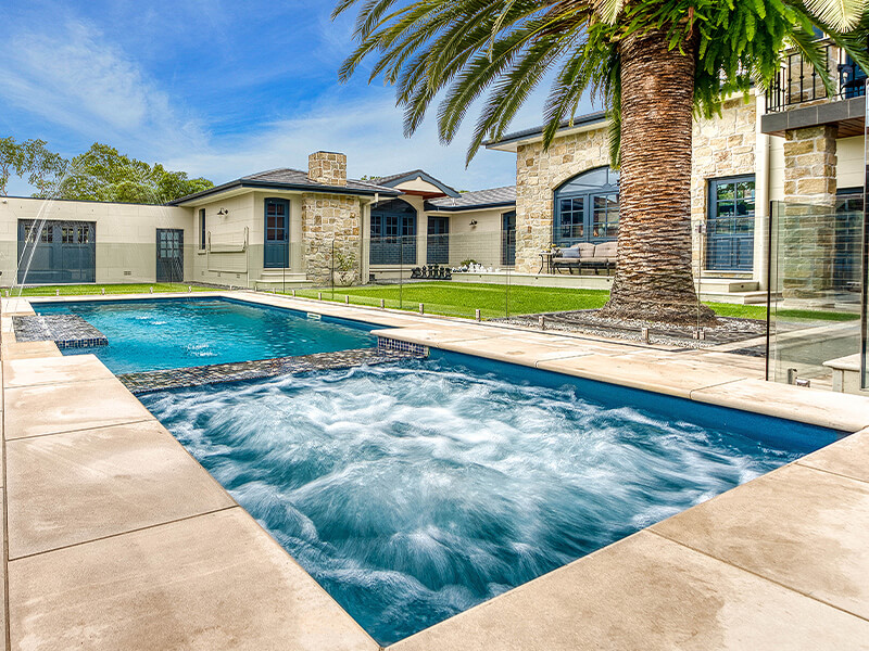 Swimming pool installer project featuring modern backyard layout