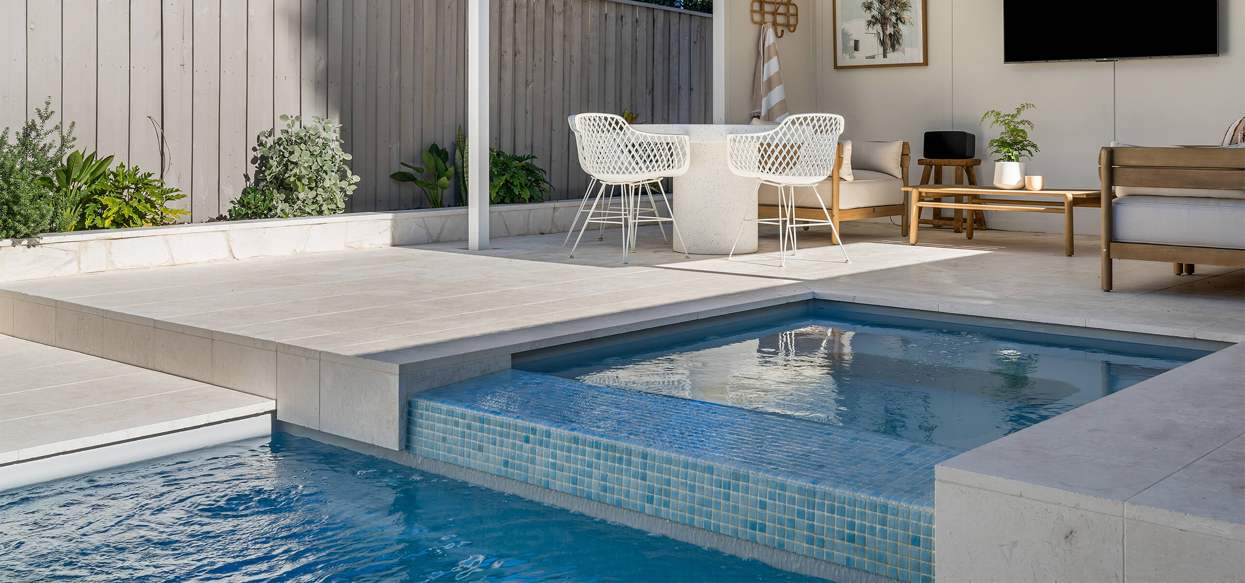 Multi-level pool features in entertaining backyard