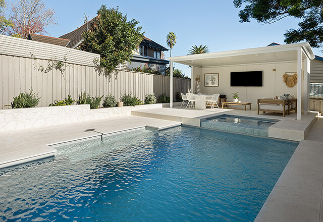 Backyard fibreglass pool installation in Bundaberg with outdoor seating area