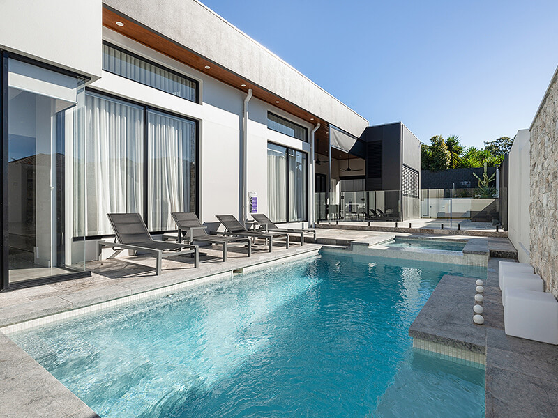 Swimming pool installer project featuring modern backyard layout