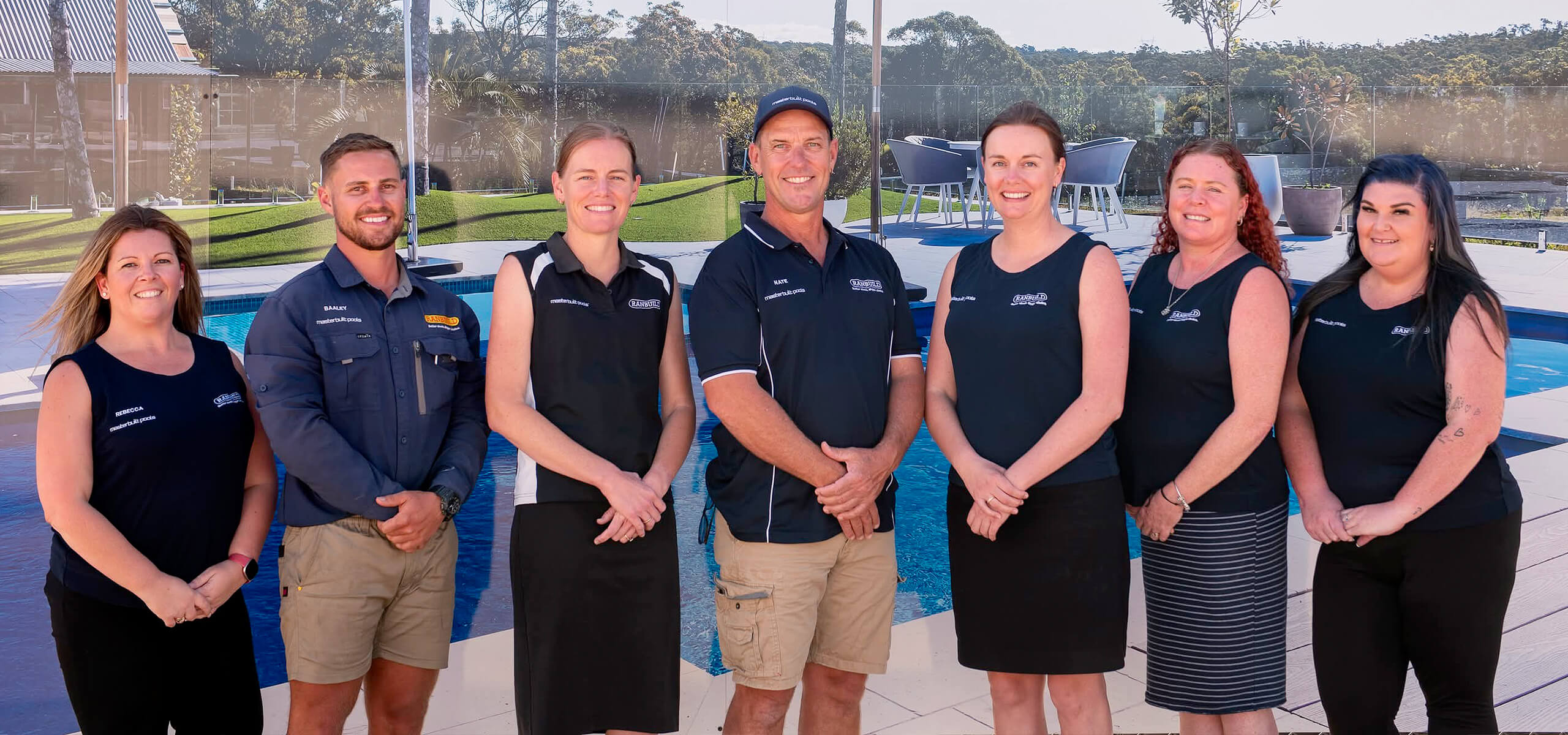 The Masterbuilt Team standing in front of showroom