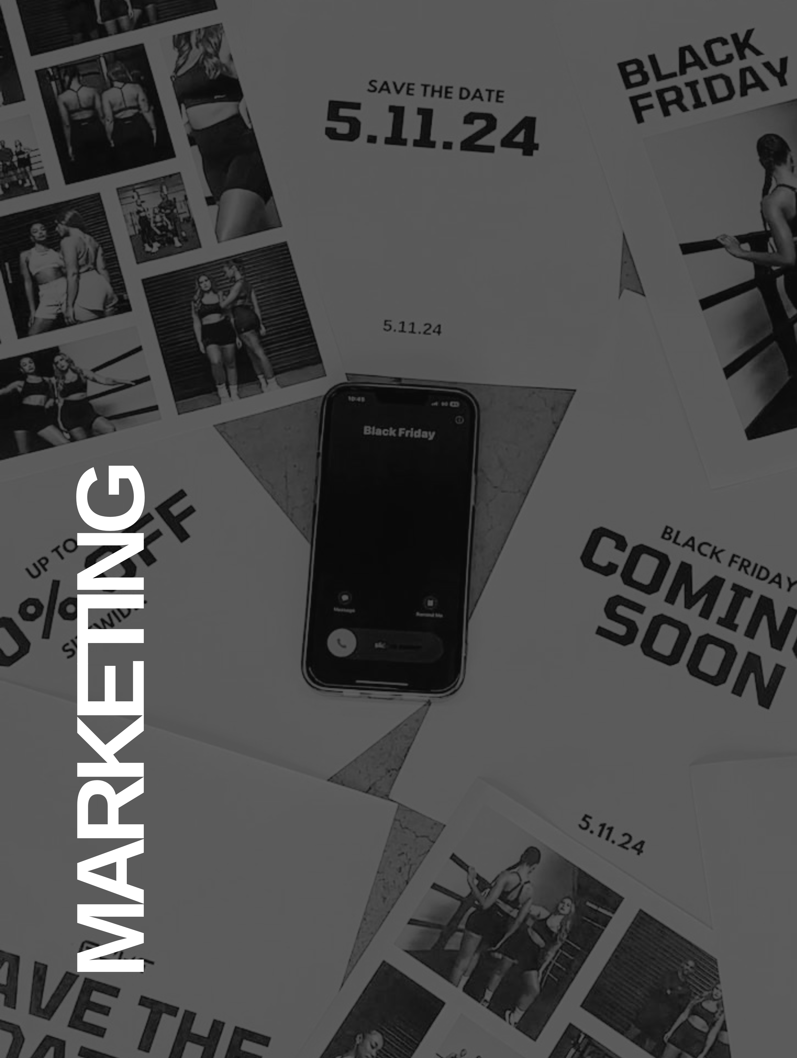 Flat lay of fitness marketing materials and a phone screen showing a Black Friday call.