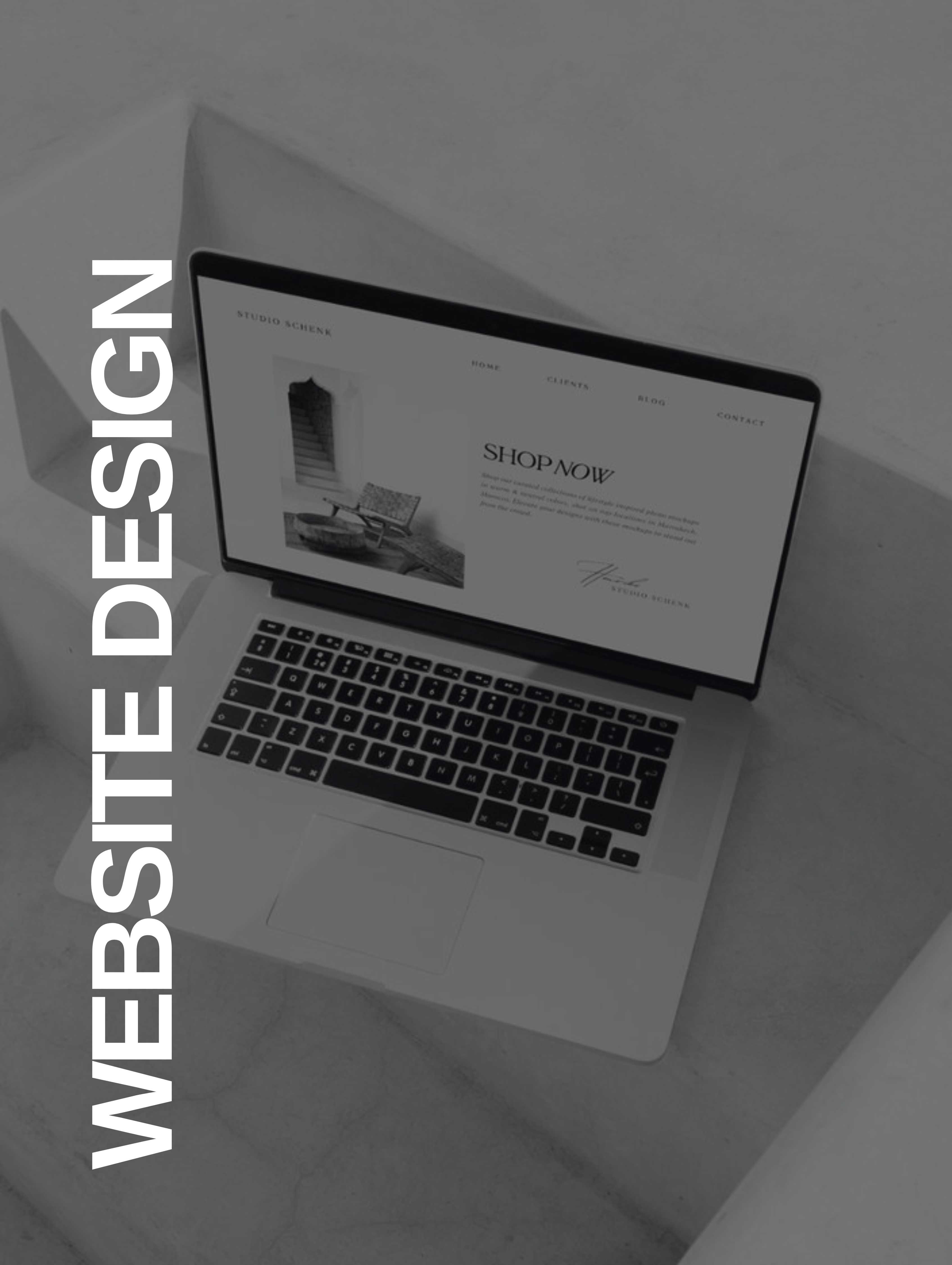 Laptop on a gray stone surface showing a stylish website design with navigation menu and Shop Now section.