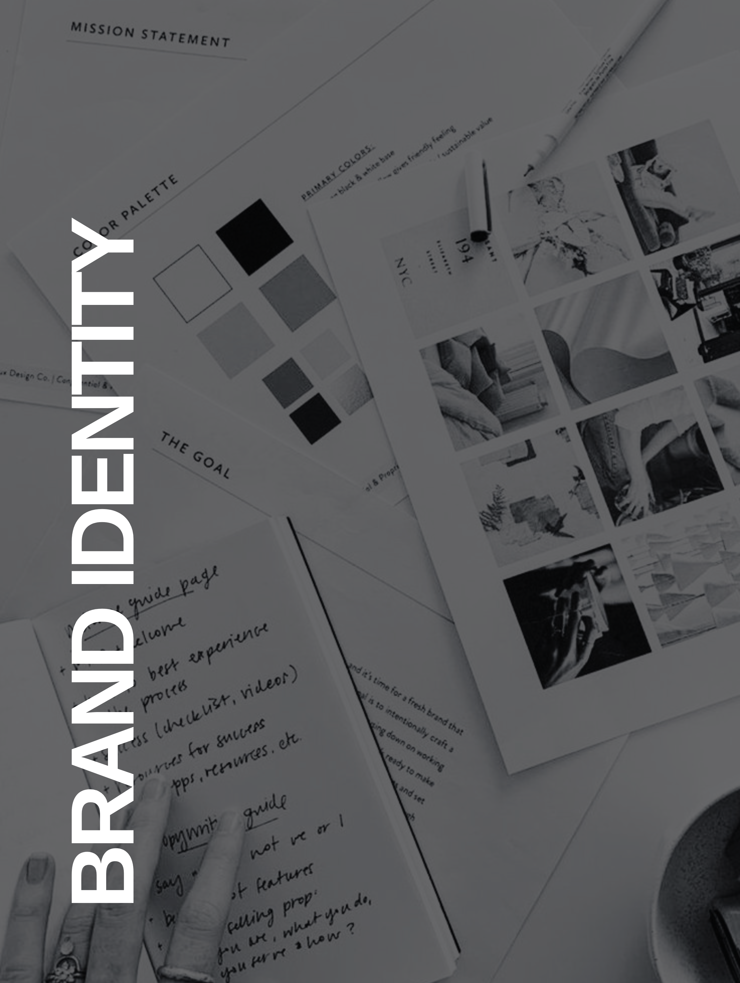 Workspace with brand identity materials including color palette, mood board, and handwritten notes.