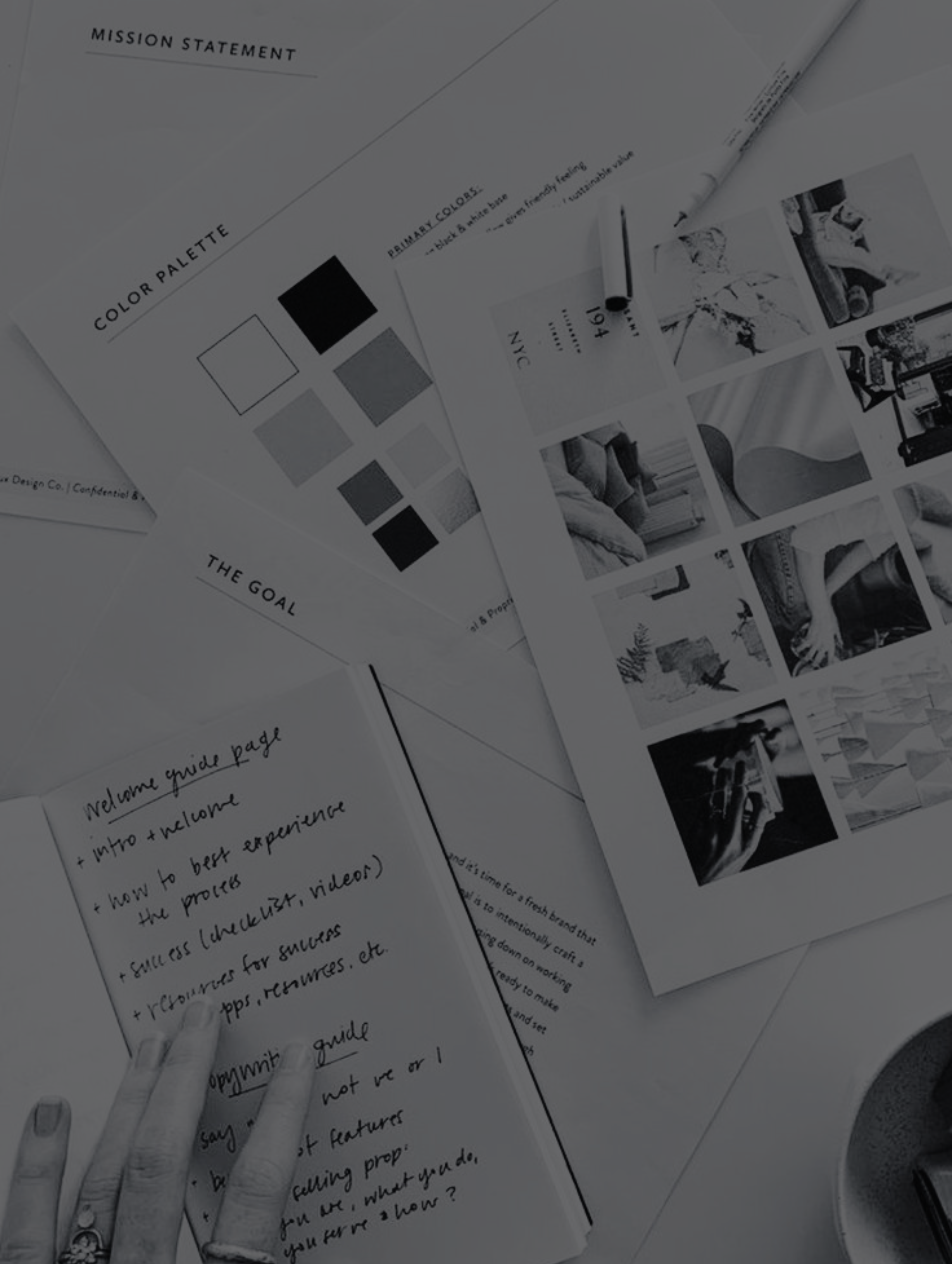 A flatlay of different mood boards and Notebook with notes for a design Project.