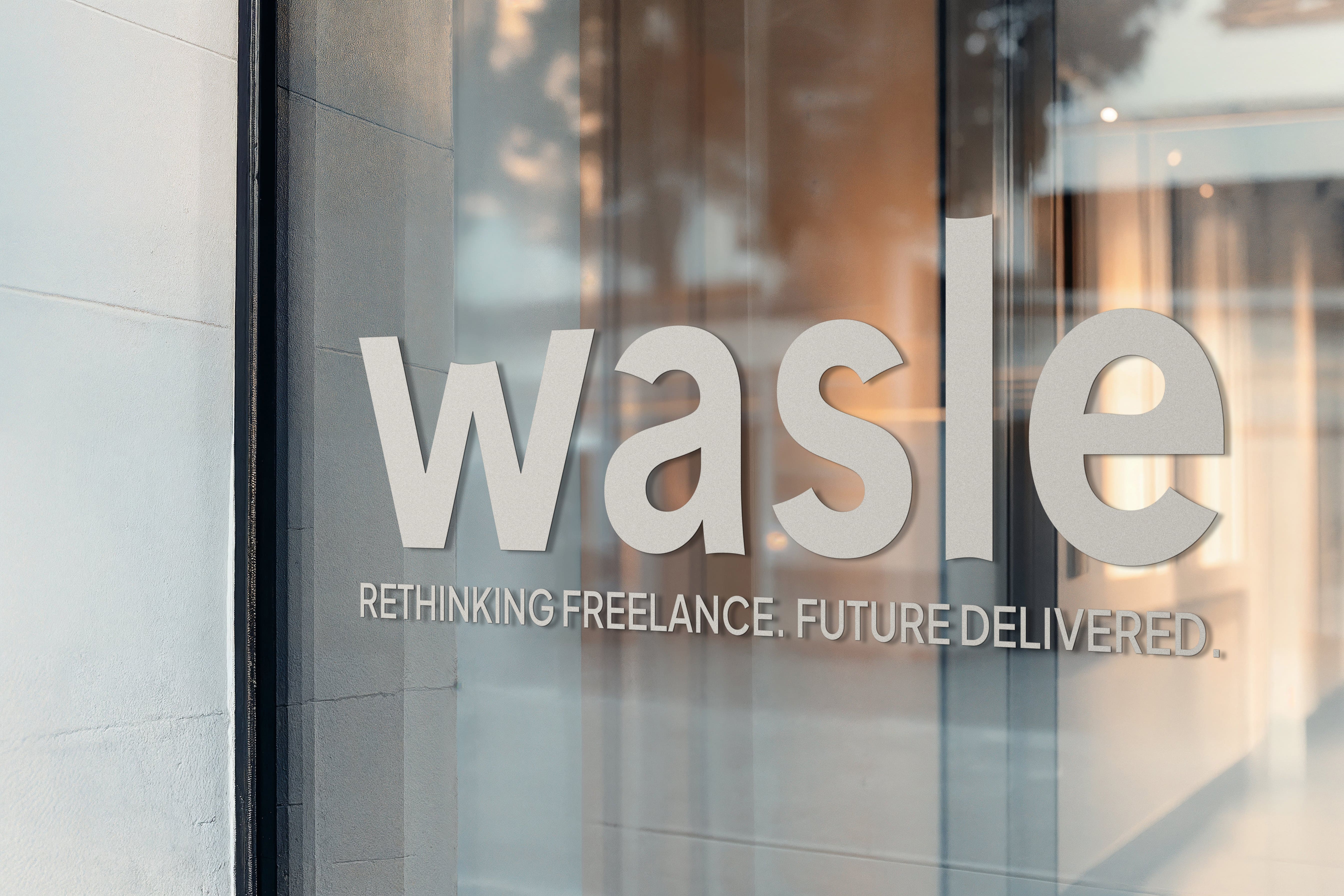 Glass door with the word 'wasle' and the tagline 'Rethinking freelance. Future delivered.'