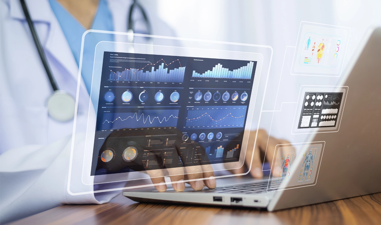 Un professionnel de la santé utilisant un ordinateur portable avec des graphiques de données médicales numériques en surimpression.