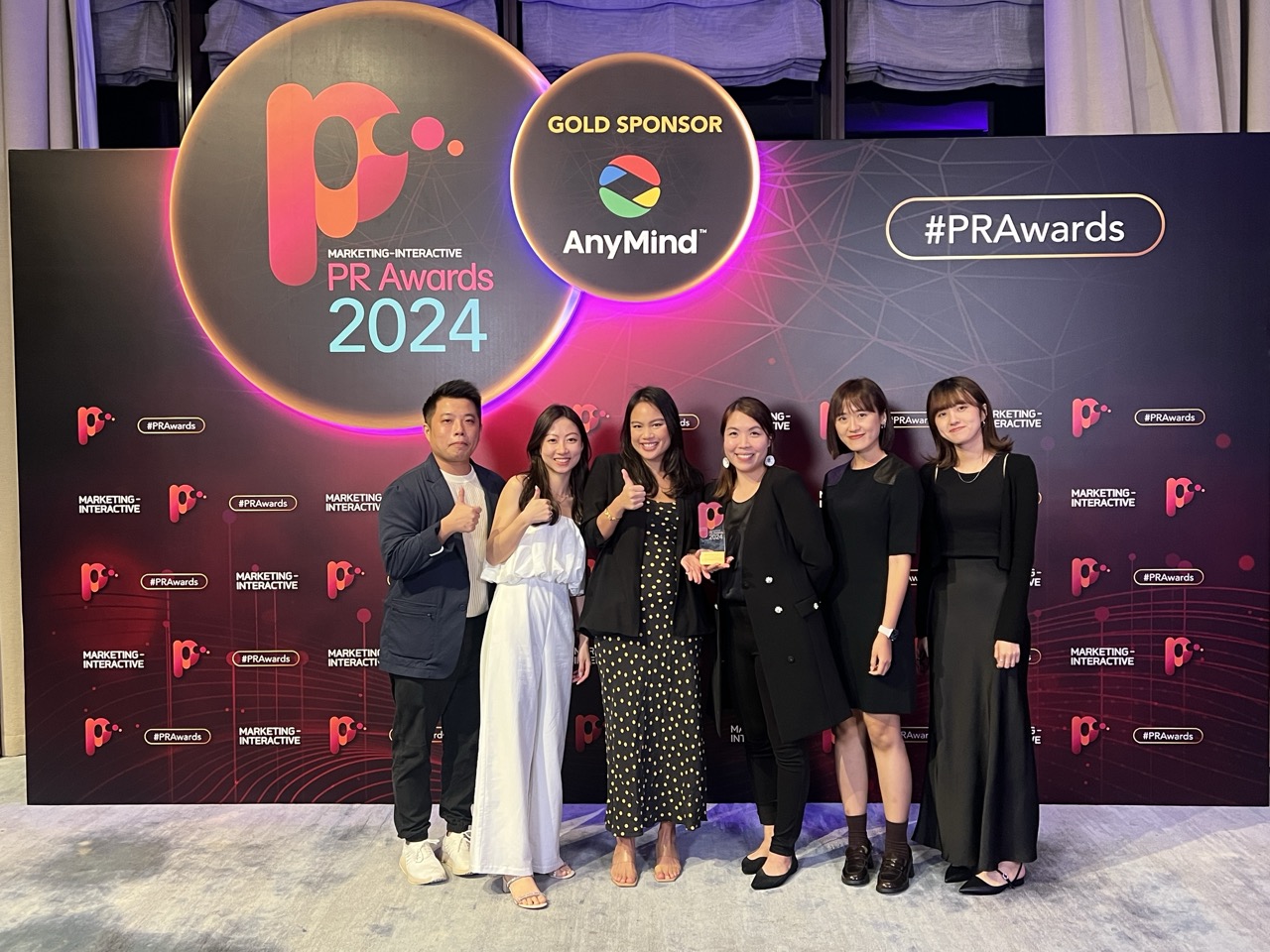 Spotlighters team with their award at the Marketing-Interactive PR Awards 2024