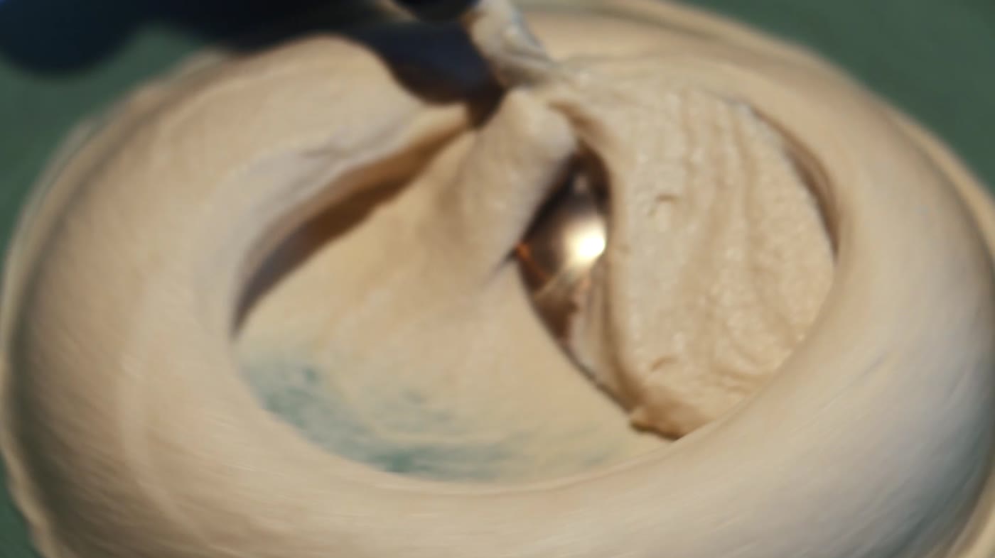 Hummus finished by hand