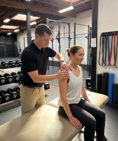 Patient working with a provider at a performance physical therapy clinic in Oakland