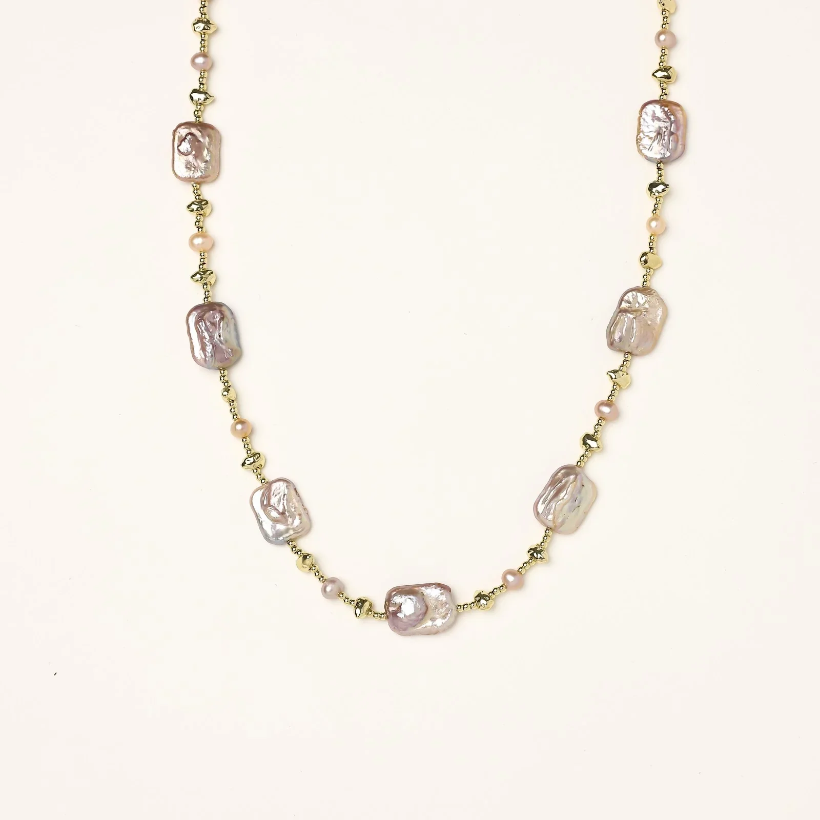 Iridescent baroque pearls alternating with small freshwater pearls on 14K gold-plated chain