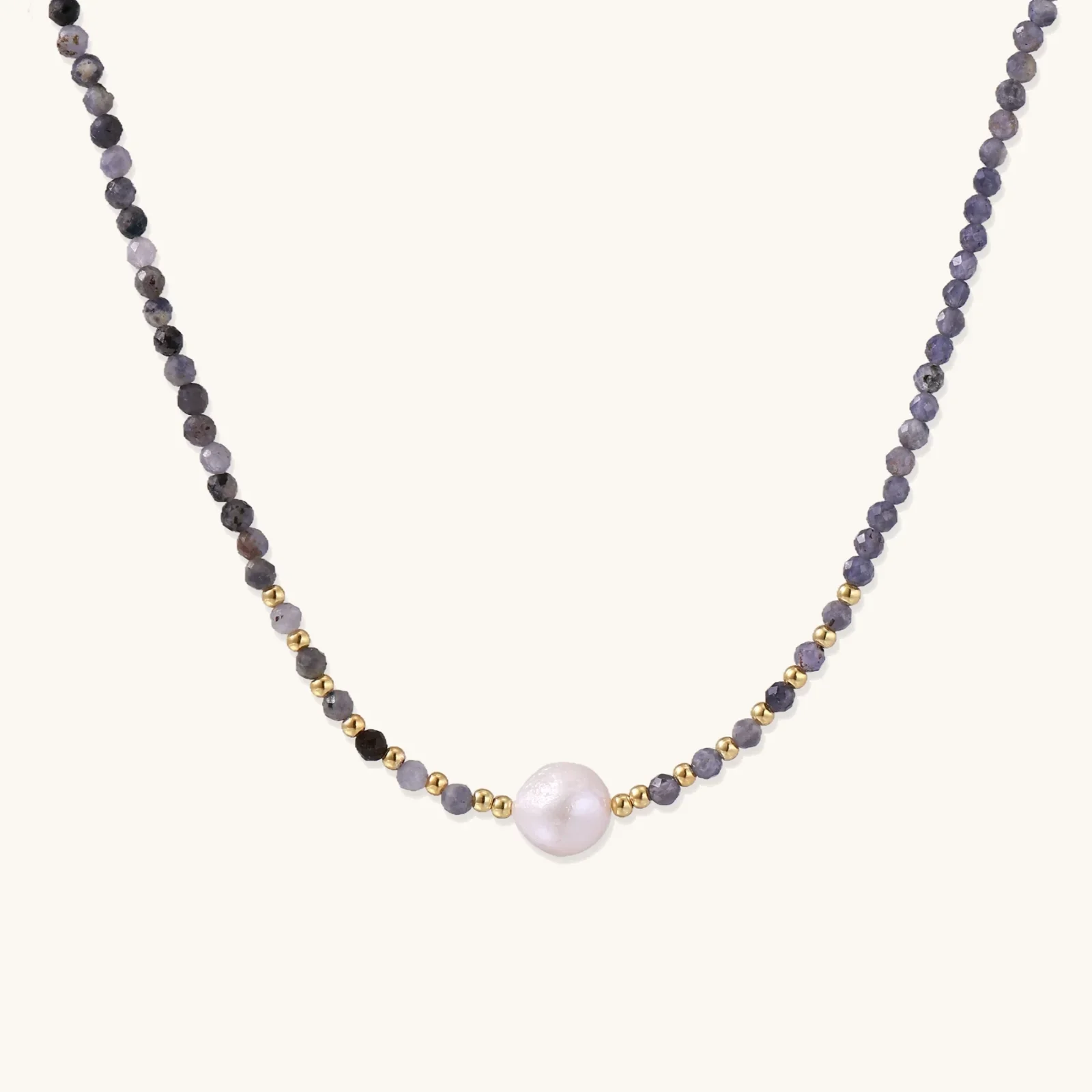 Dainty necklace with faceted purple iolite beads, gold vermeil accents, and central pink-white freshwater pearl.
