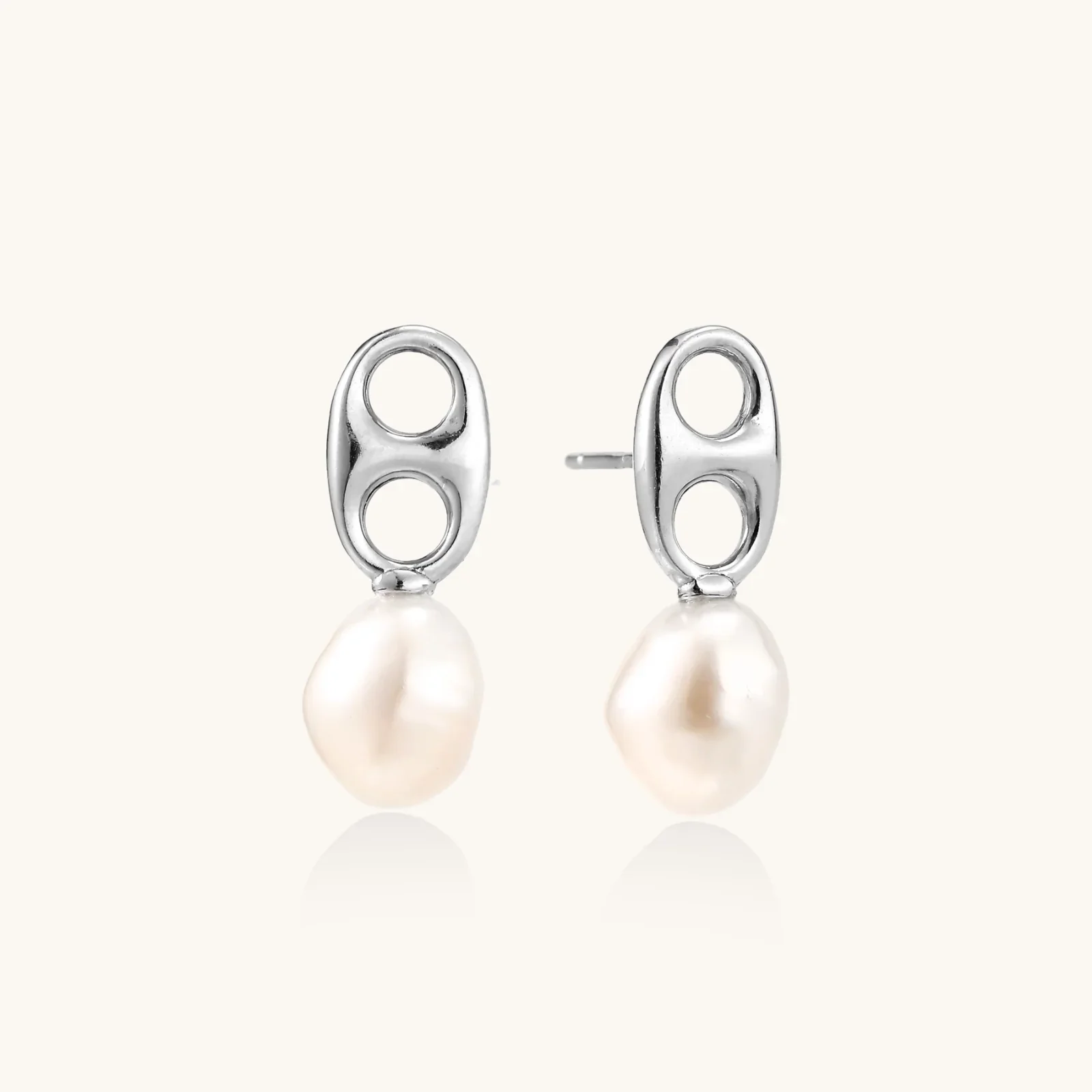 Modern rhodium-plated silver earrings with geometric double-circle design and freshwater pearl drops
