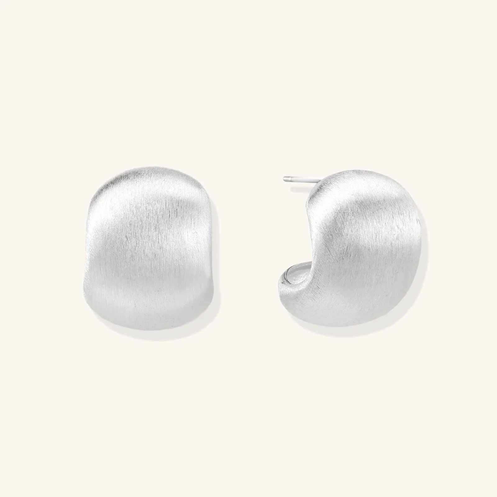 Brushed sterling silver cushion-shaped stud earrings with matte finish on white background