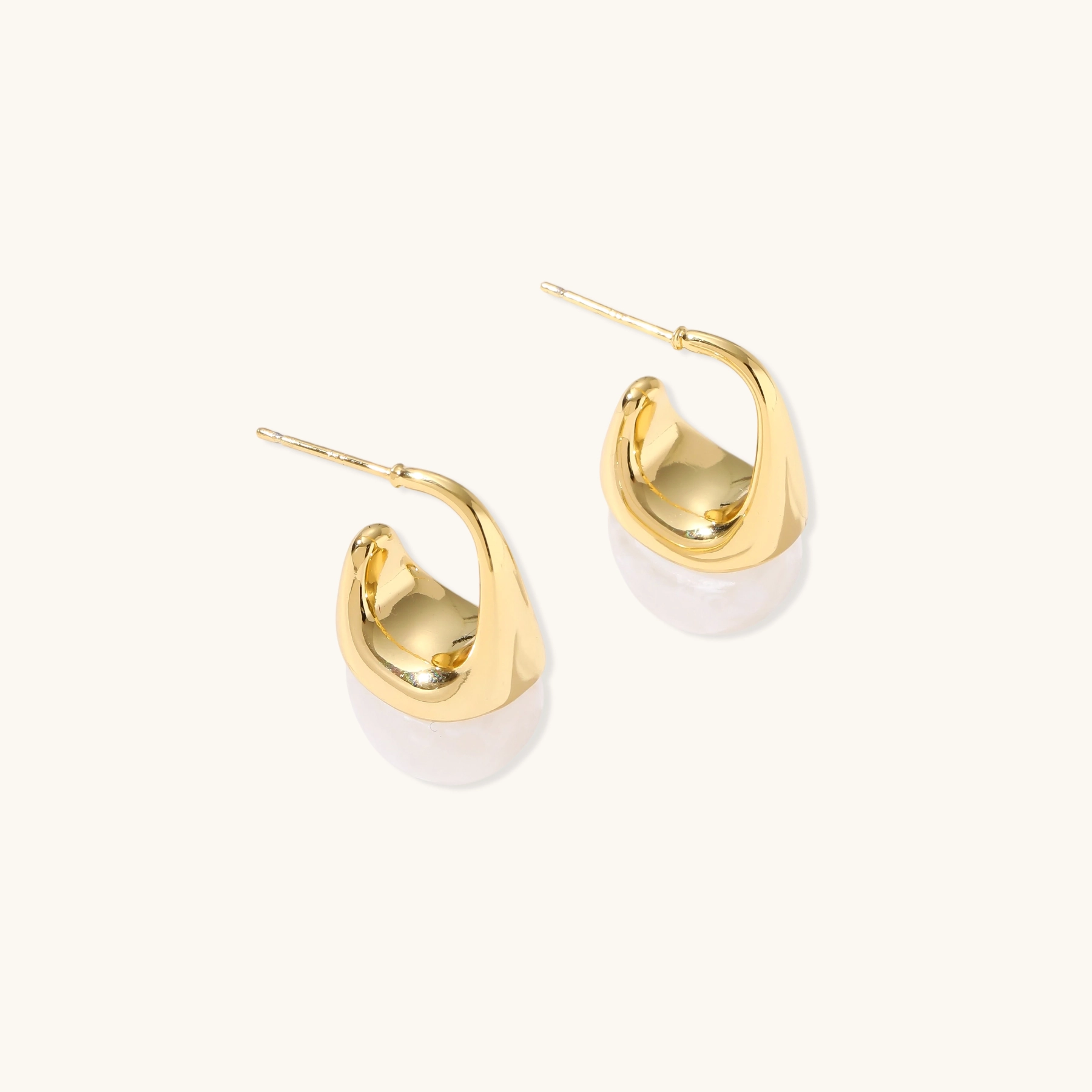Pair of small gold-plated hoop earrings with triangular cone fronts and curved backs on white background.