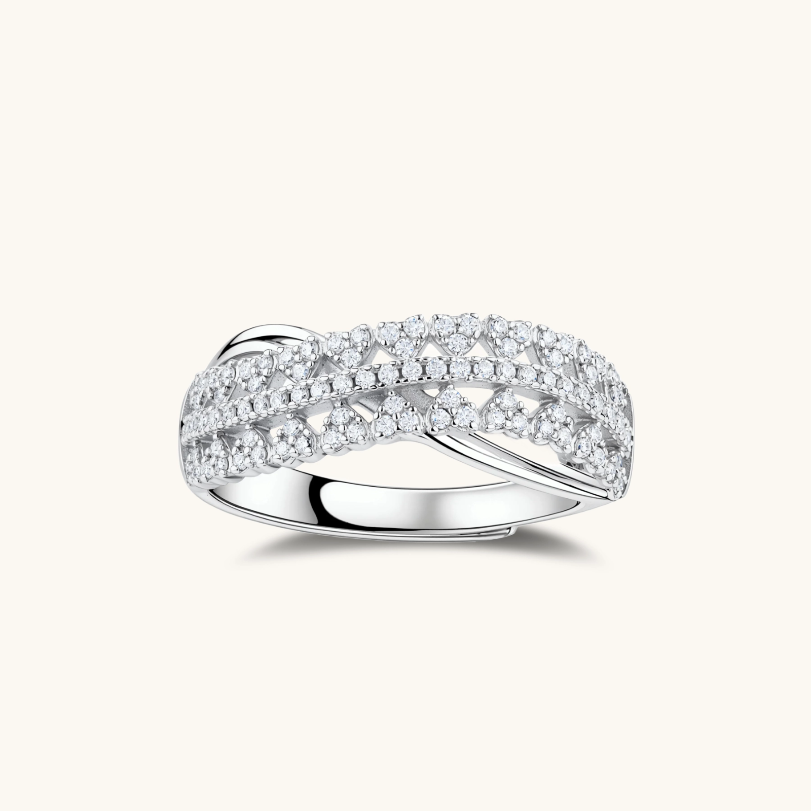 Sterling silver crossover ring with pavé-set moissanite stones creating an elegant infinity design on neutral background