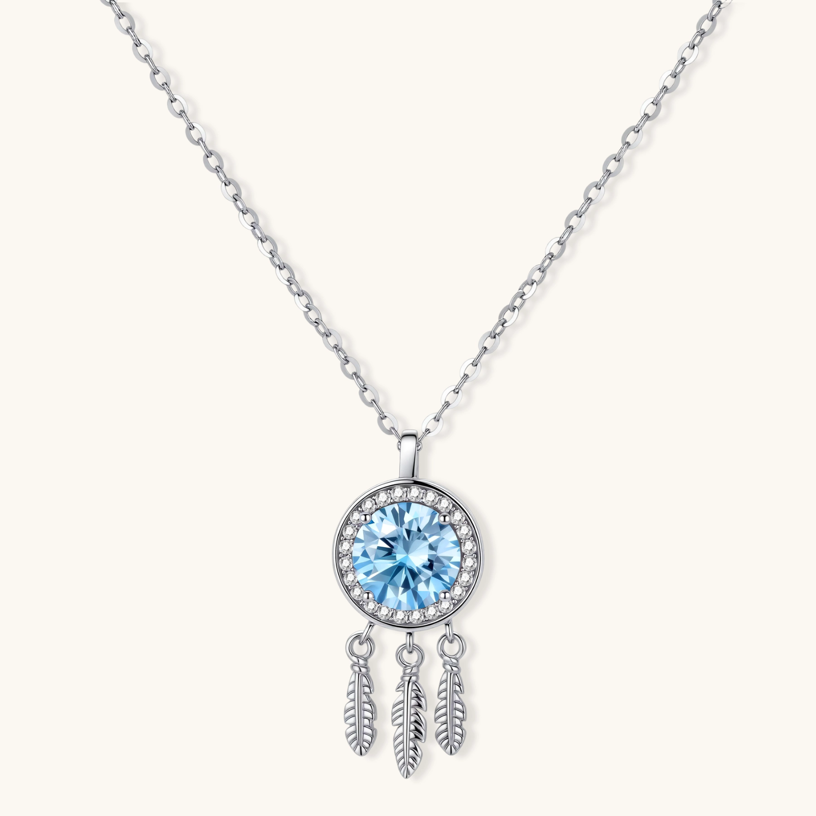 Sterling silver dreamcatcher pendant with blue moissanite center and three feather charms on adjustable chain.