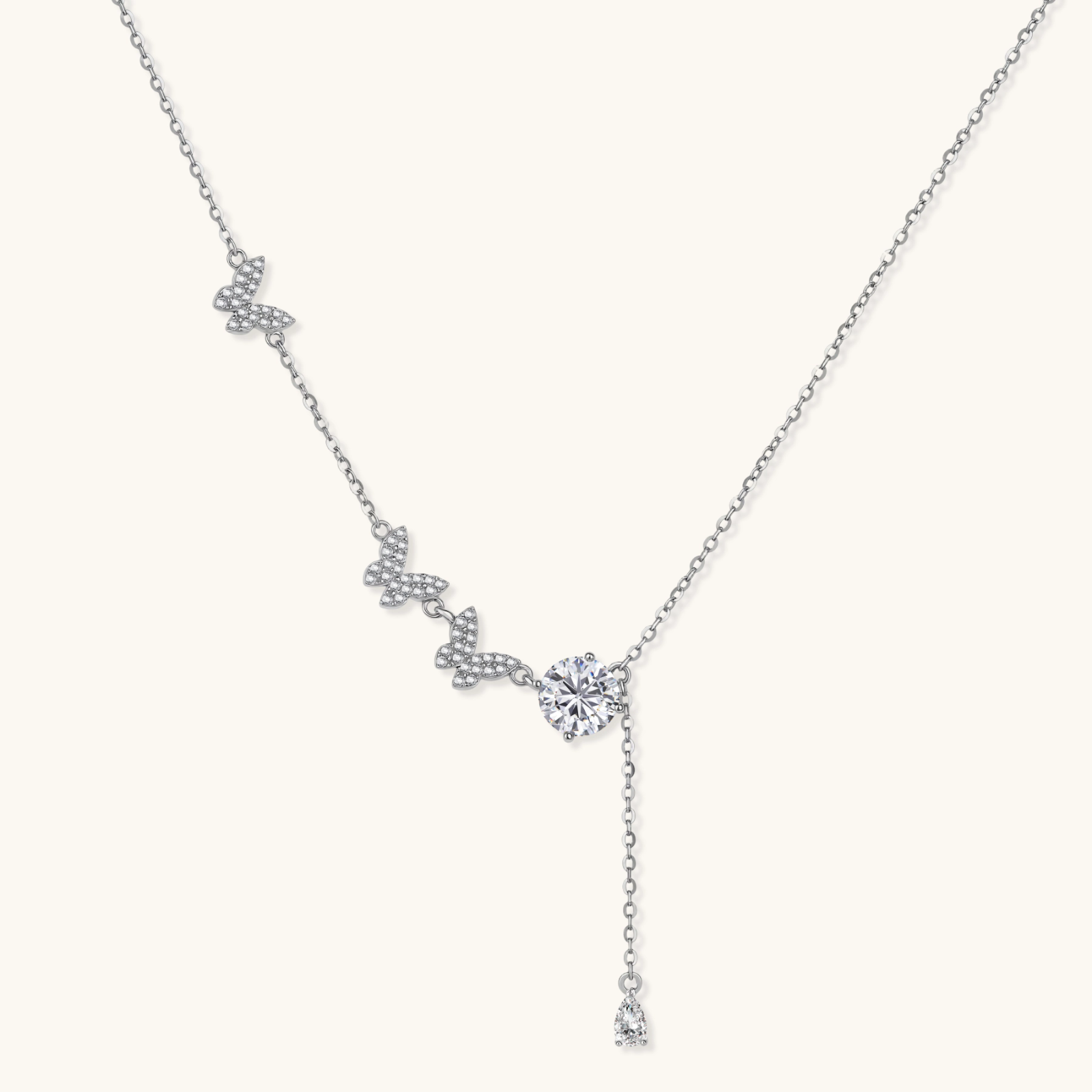 Sterling silver Y-shaped necklace with butterfly charms and brilliant moissanite stone with teardrop pendant