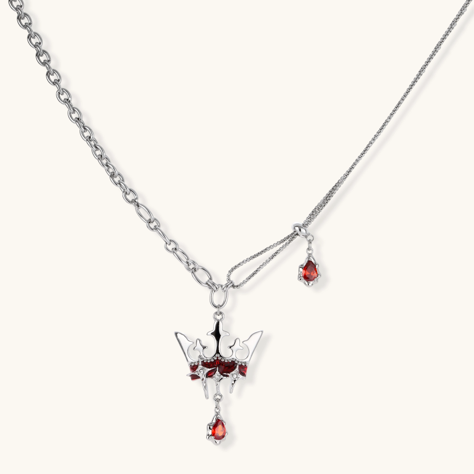 Eco-brass crown pendant necklace with red enamel details and dangling zirconia stone on chunky adjustable chain