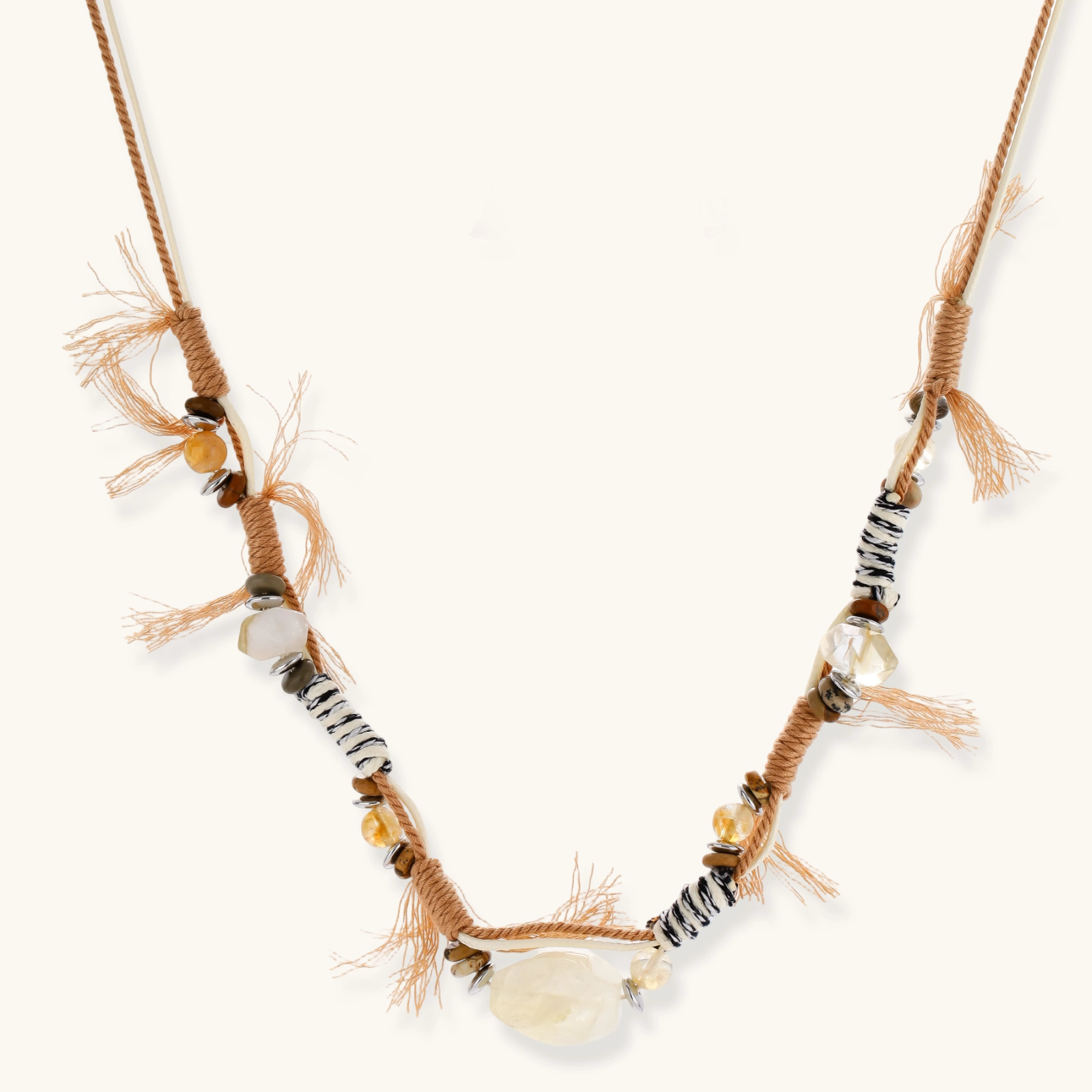 Adjustable brown cord necklace with citrine, coffee calcite beads and striped accents on white background.