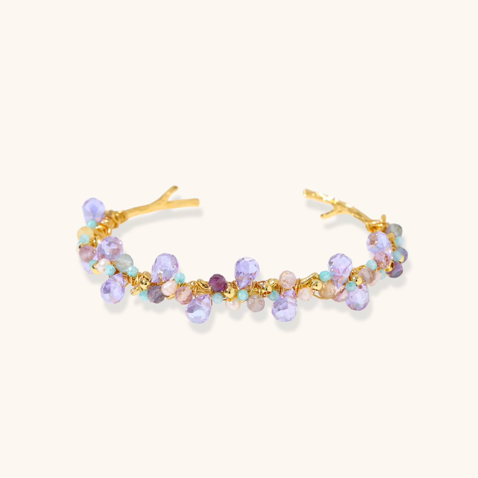 Gold-plated adjustable cuff bracelet with clustered lavender fluorite, turquoise beads, and freshwater pearls on white background.