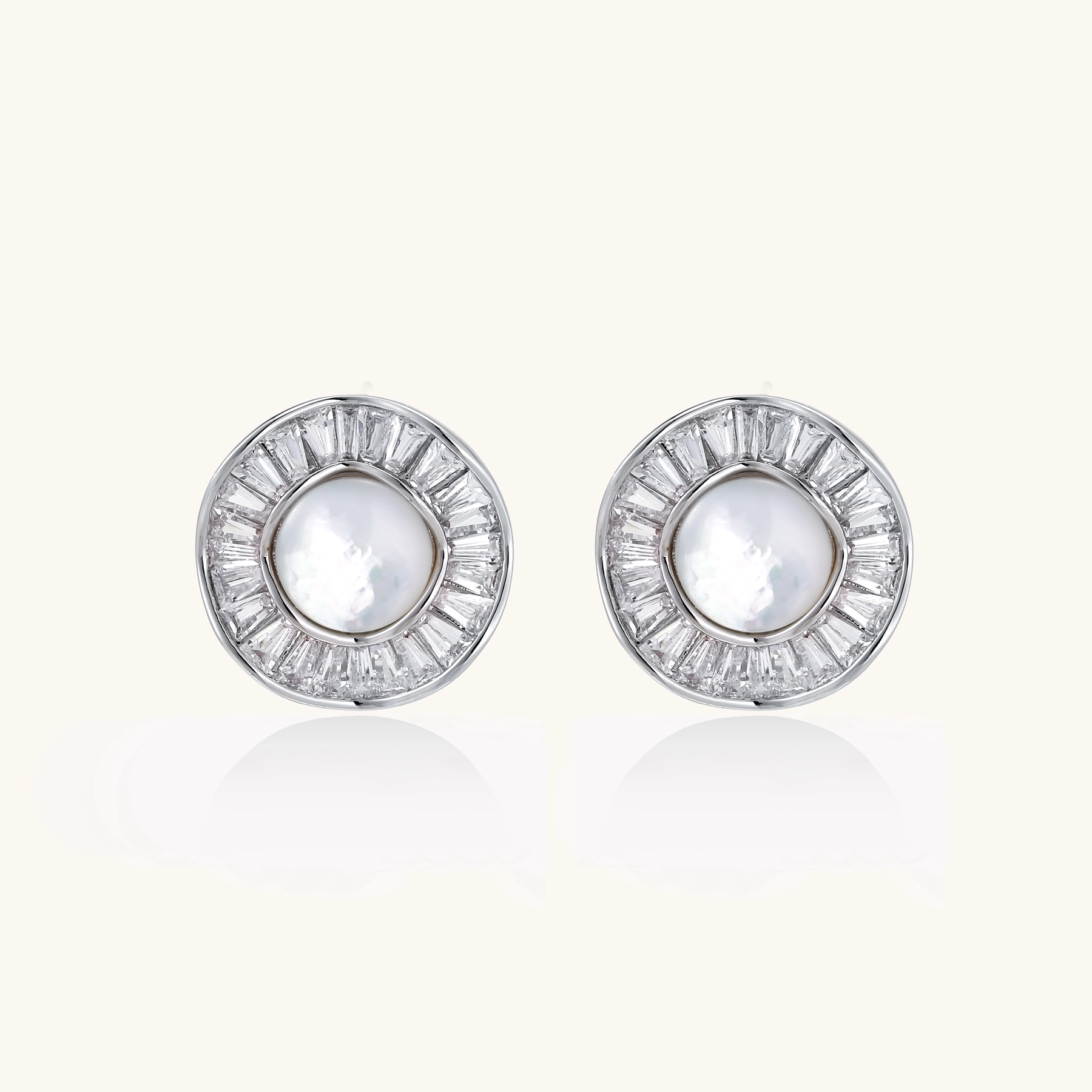 14K gold-plated stud earrings with freshwater pearl center surrounded by baguette-cut crystal halo in sunburst design