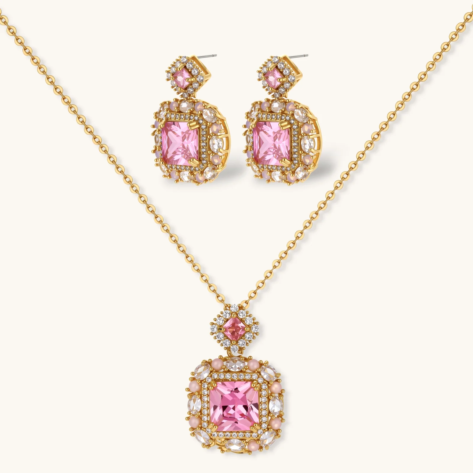 14K gold-plated jewelry set featuring square-cut cubic zirconia stones in ornate layered settings on white background.