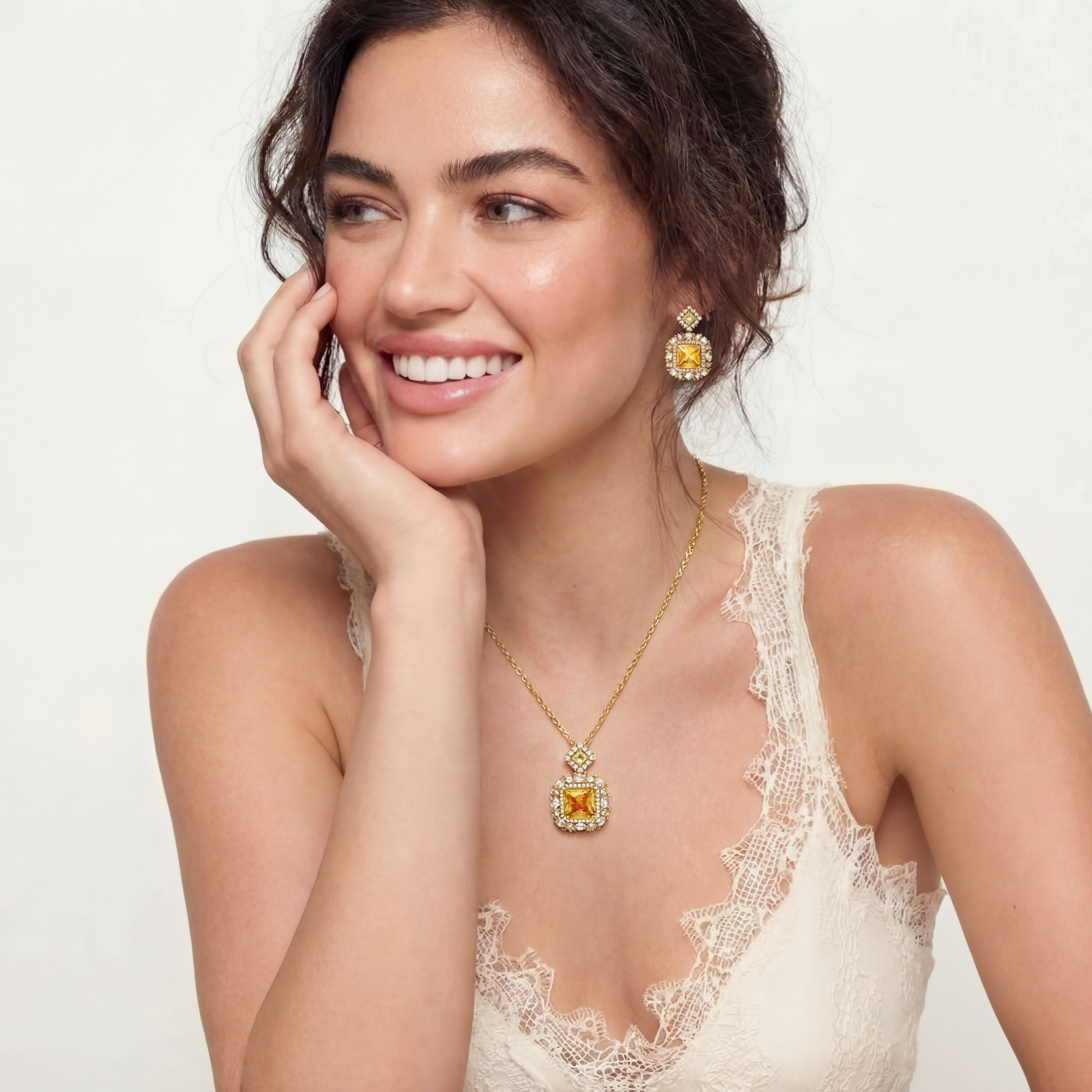 14K gold-plated jewelry set featuring square-cut cubic zirconia stones in ornate layered settings on white background.
