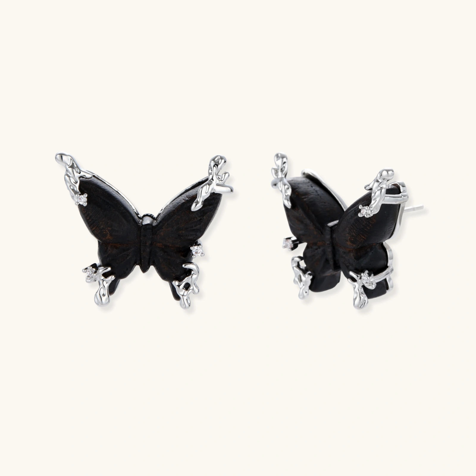 Wooden butterfly earrings with silver chain details in light and dark wood variants on white background