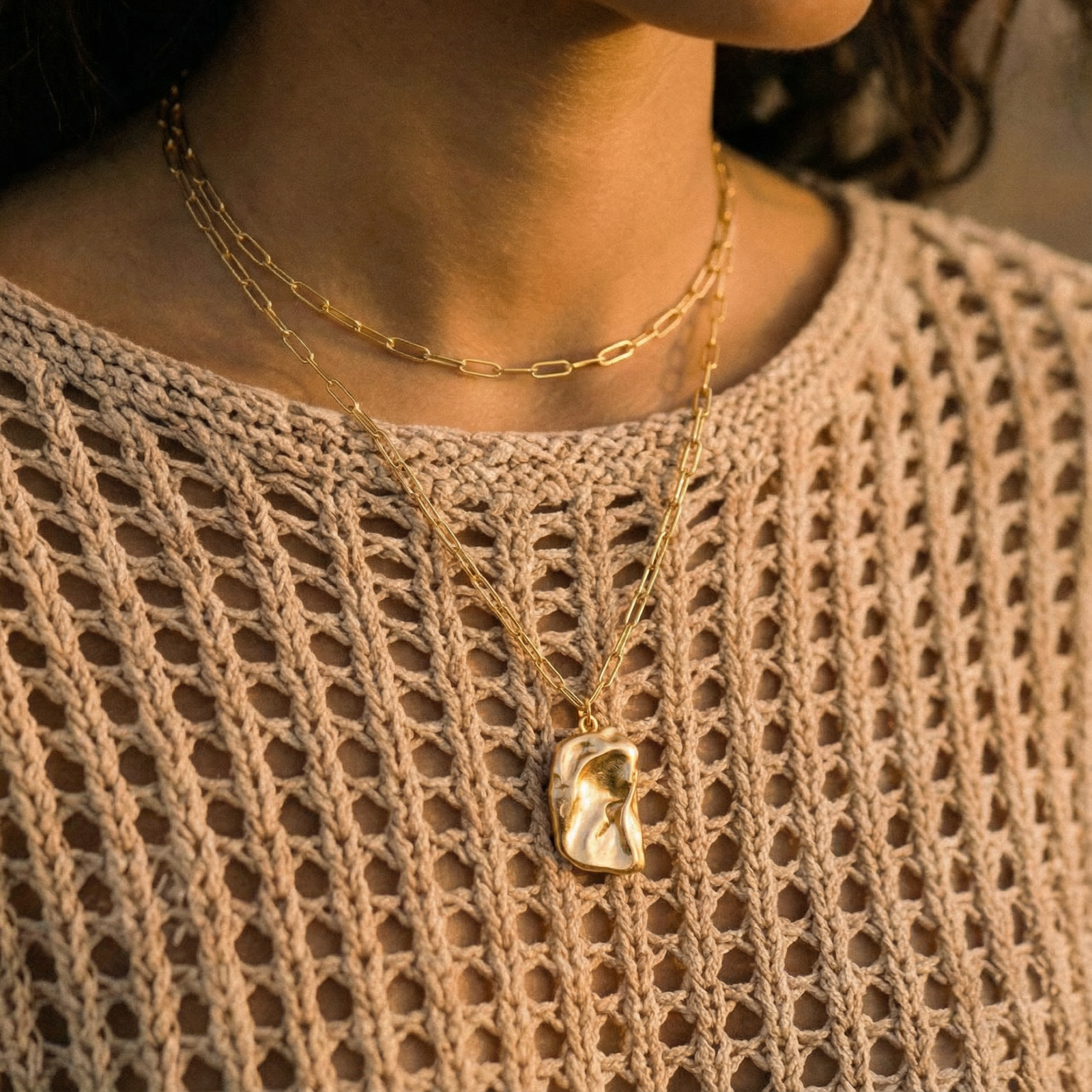 Layered paperclip chain necklace with organic flowing pendant made from eco-zinc alloy in warm gold finish