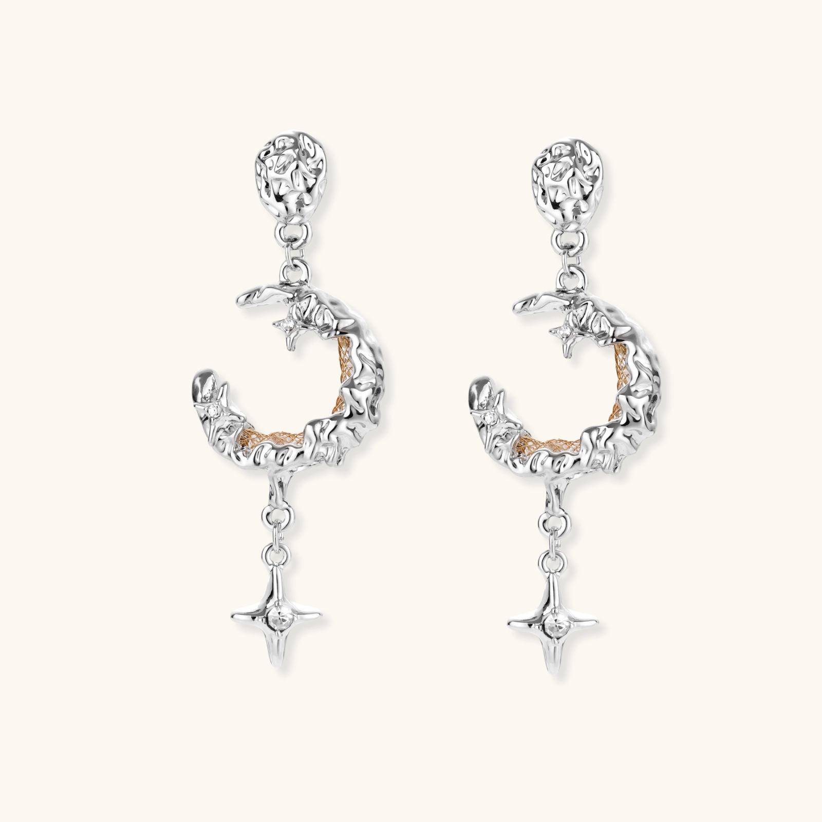 Detailed eco-brass dangle earrings featuring crescent moons with gold rope details and dangling star charms on white background.