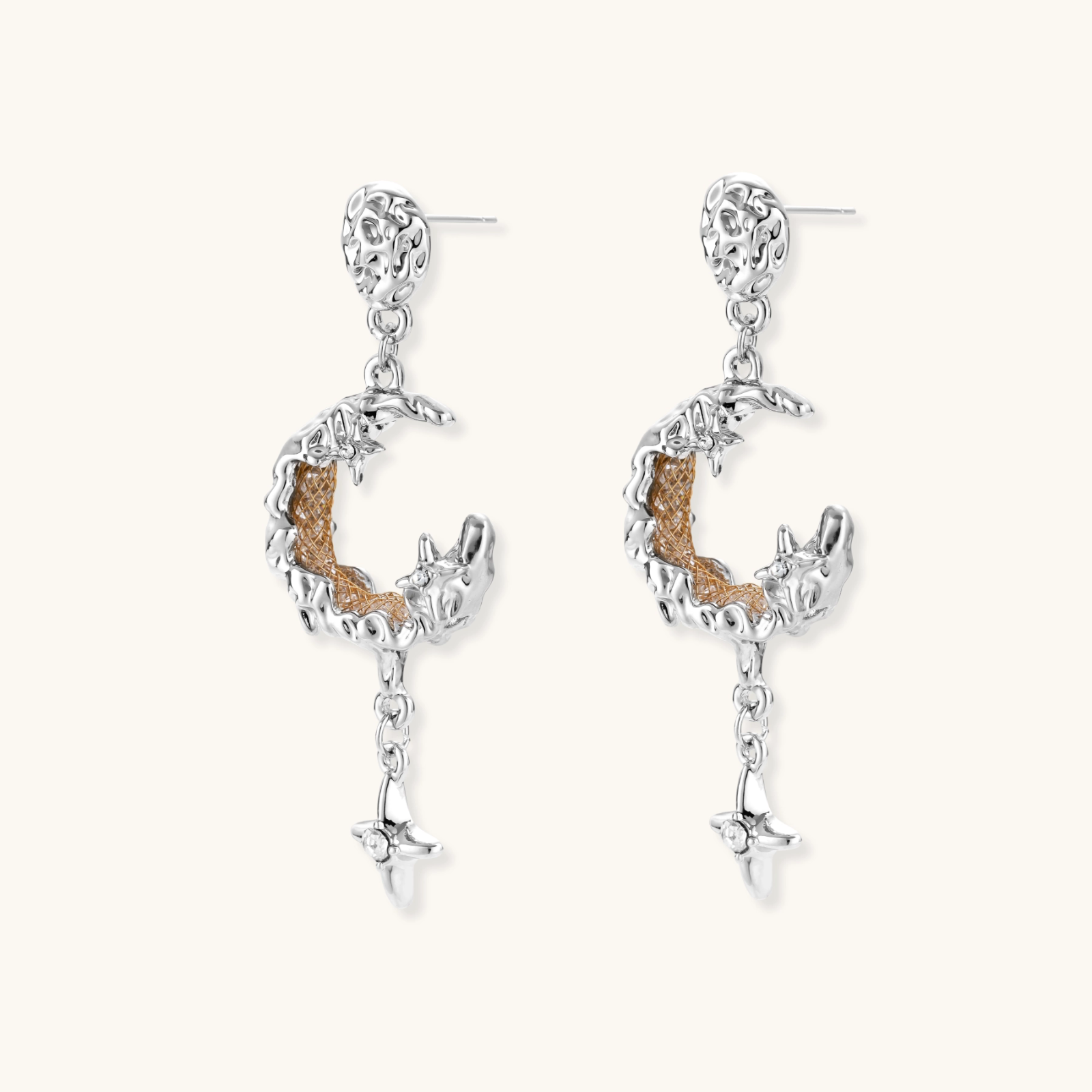 Detailed eco-brass dangle earrings featuring crescent moons with gold rope details and dangling star charms on white background.