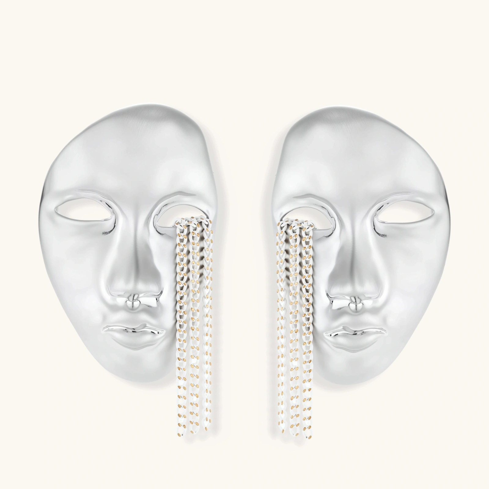 Sculptural face-shaped earrings with flowing chain tassels in polished eco-zinc alloy with sterling silver posts