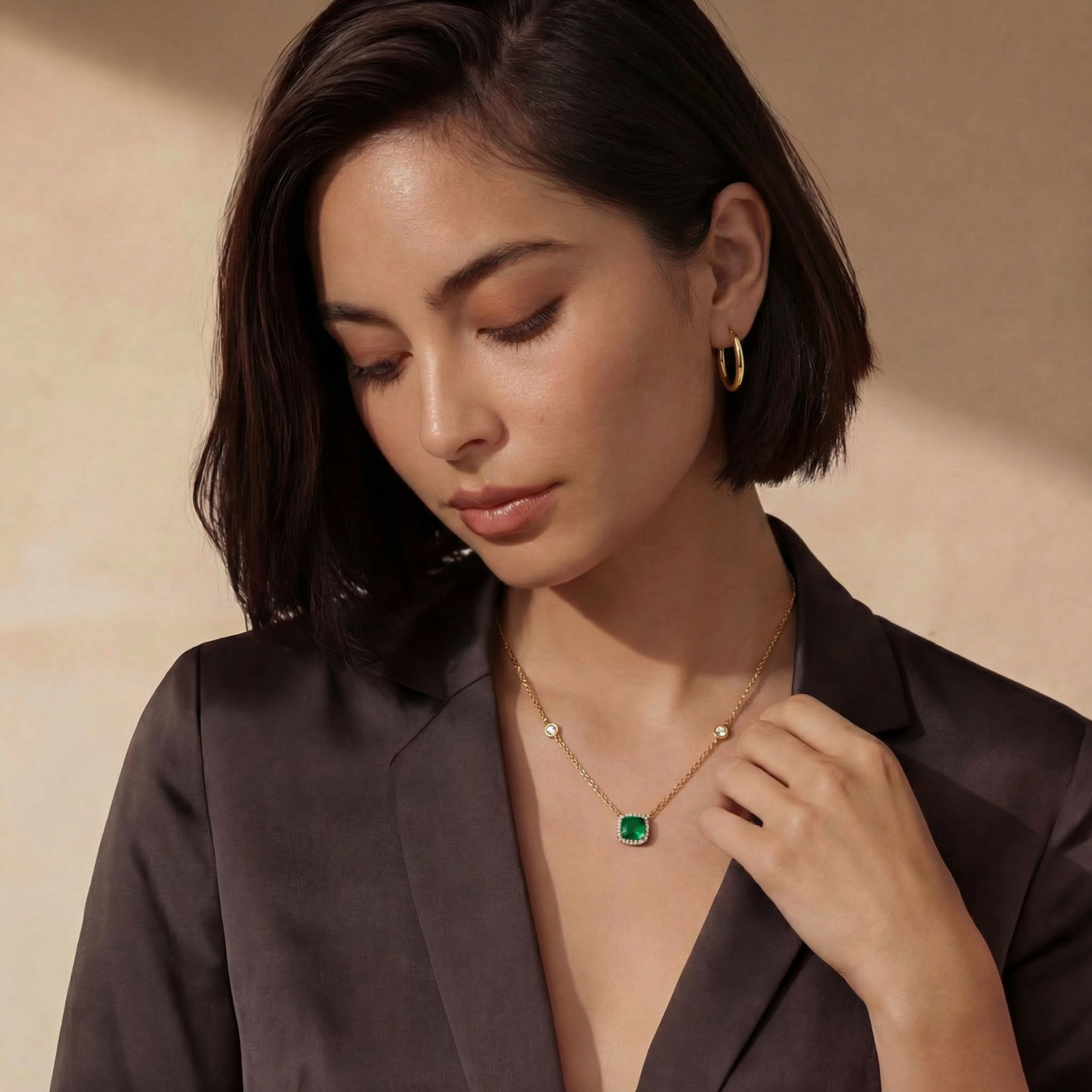 Polished gold-plated sterling silver hoop earrings with hinged closure mechanism on white background.