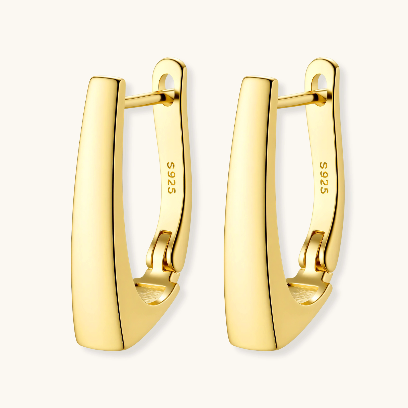 Sleek 14K gold-plated sterling silver huggie earrings with polished finish and geometric elongated design on white background.