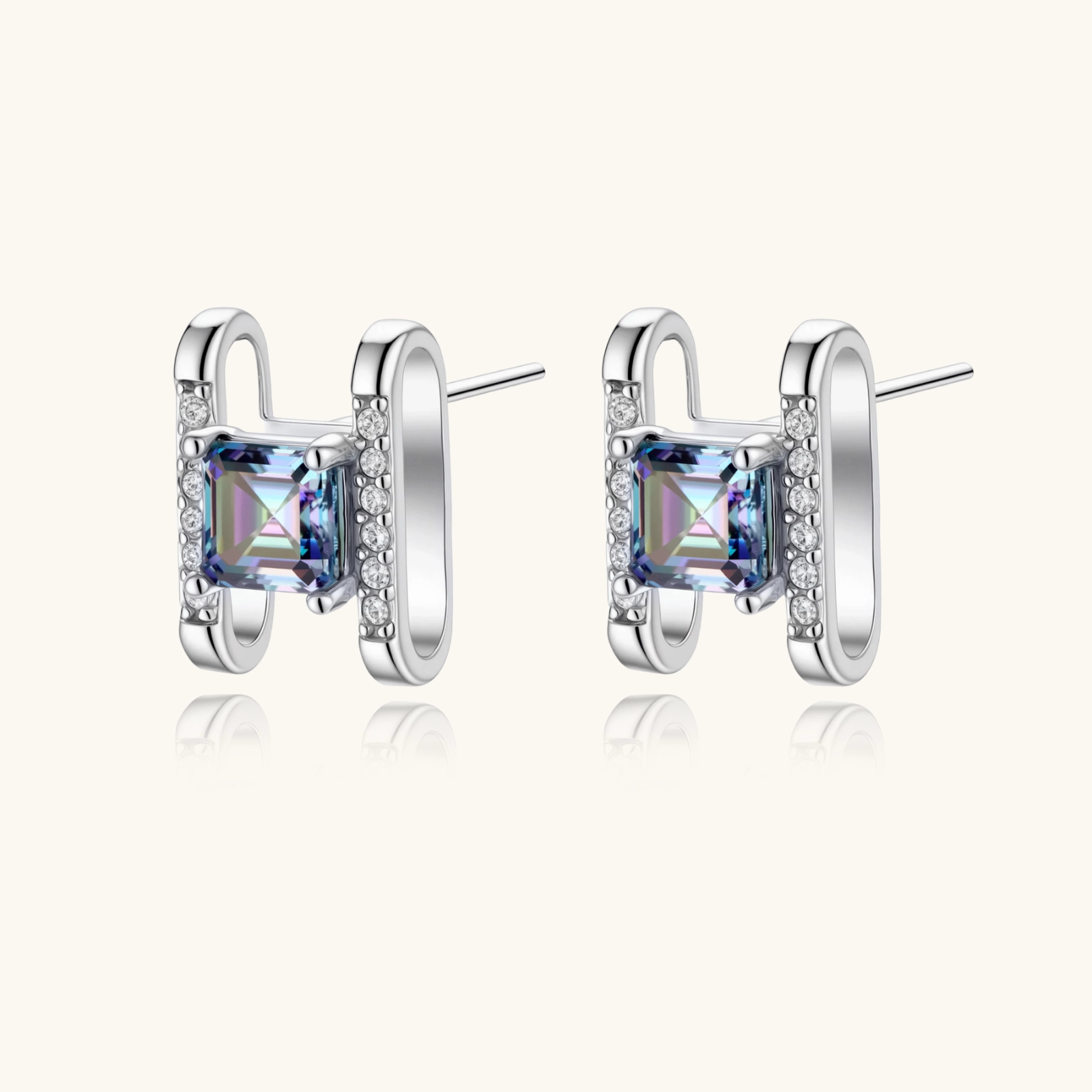 Square moissanite studs in sterling silver geometric setting showing rainbow prismatic fire on white background.