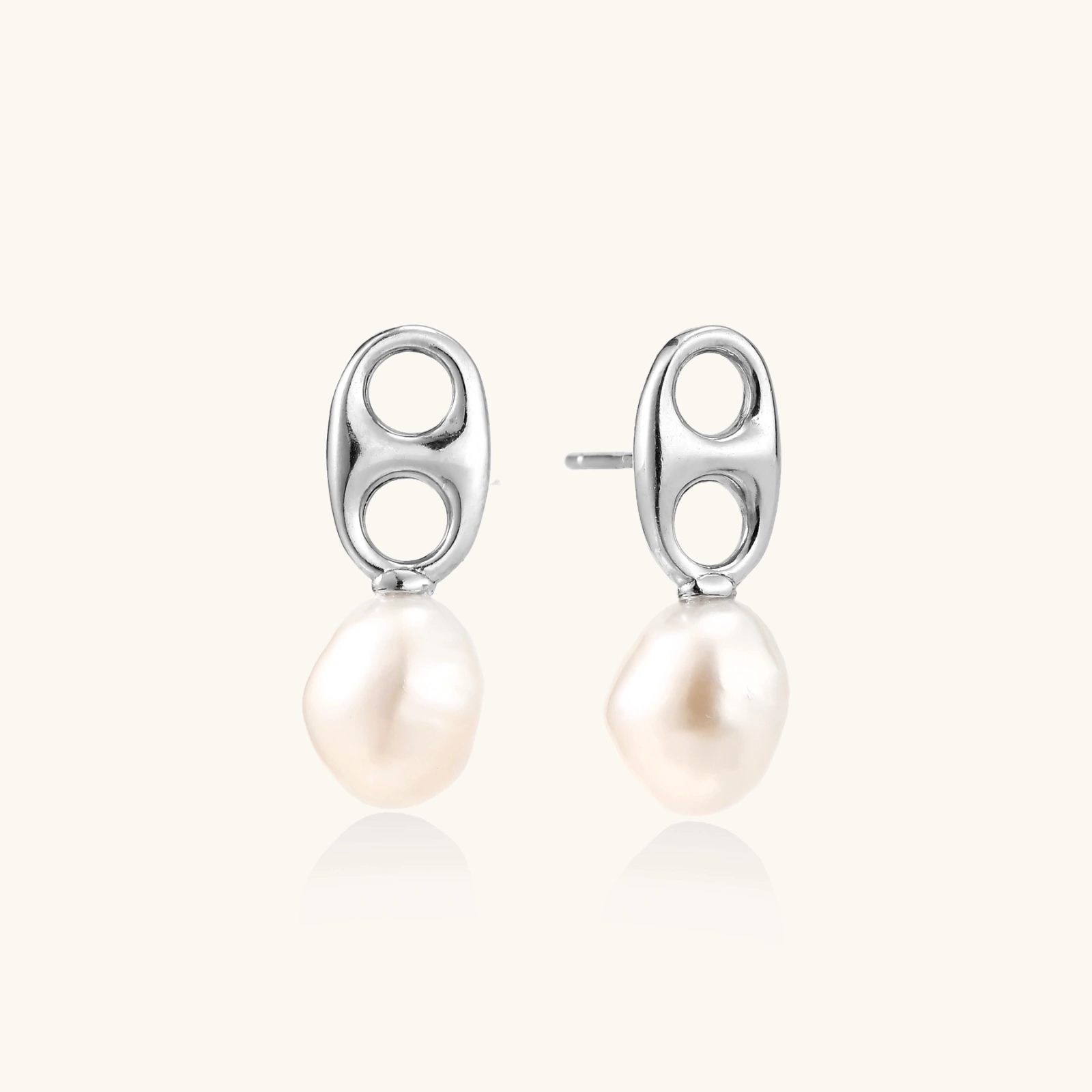 Modern rhodium-plated silver earrings with geometric double-circle design and freshwater pearl drops